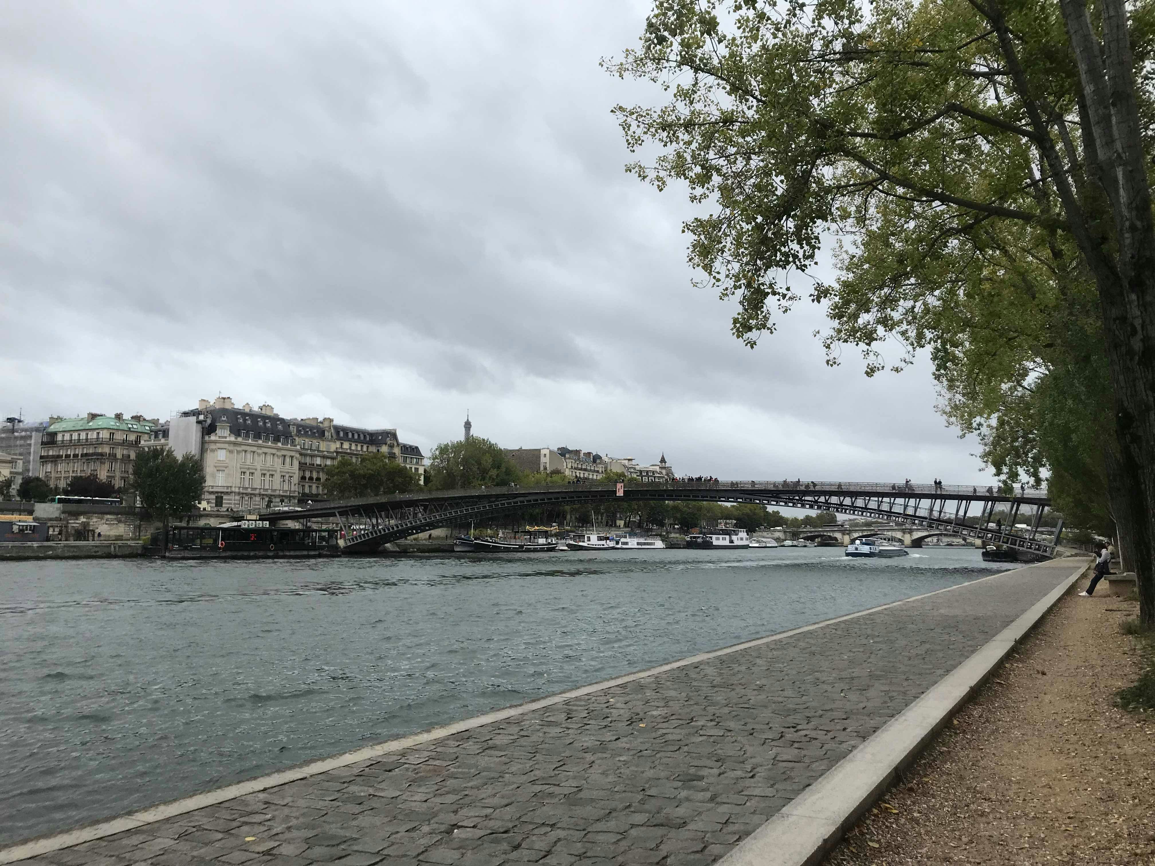 A bridge stretches across the Seine on a dull day.