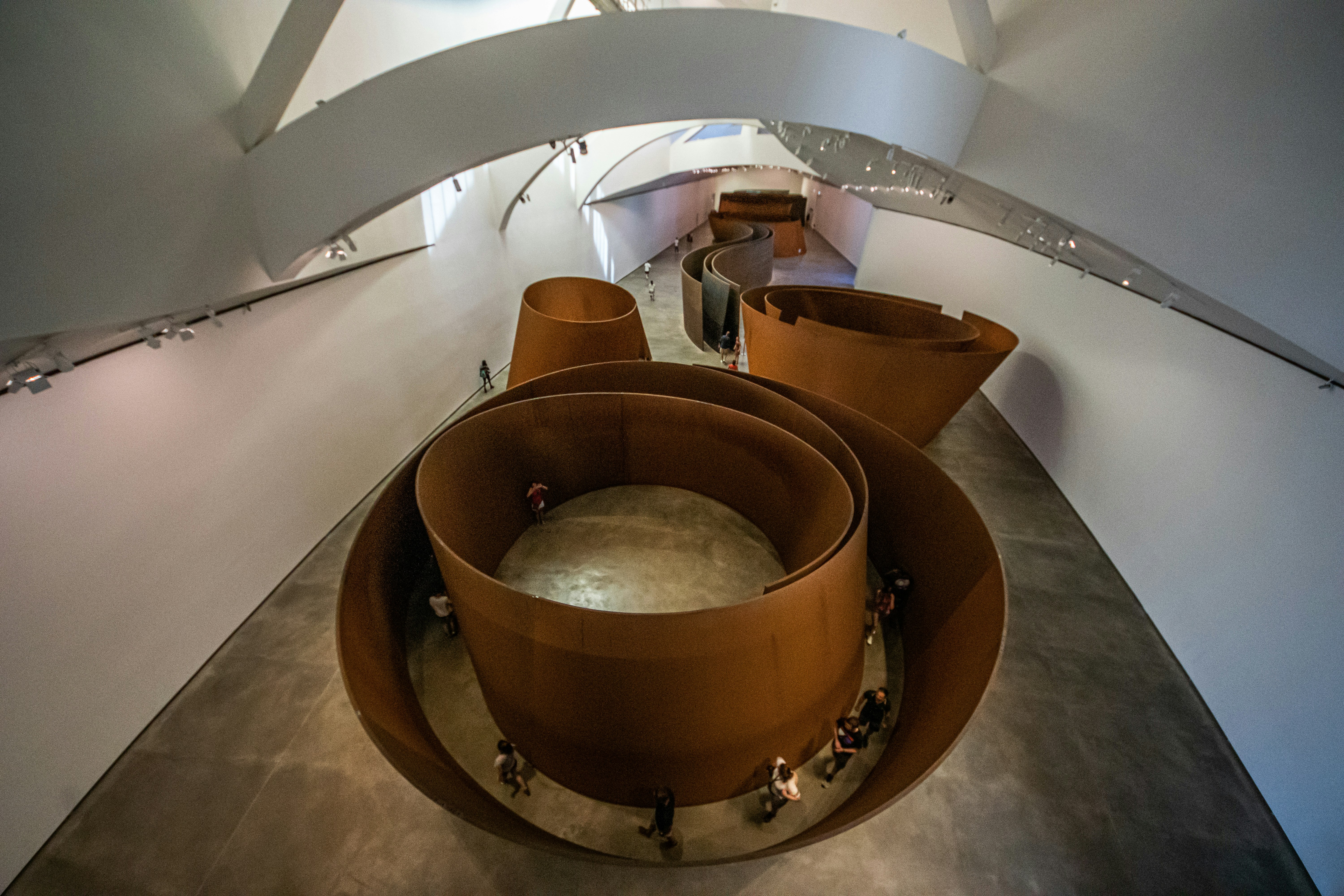 Richard Serra's The Matter of Time installation at the Guggenheim museum, resembling eight pieces of gigantic torqued ellipses.