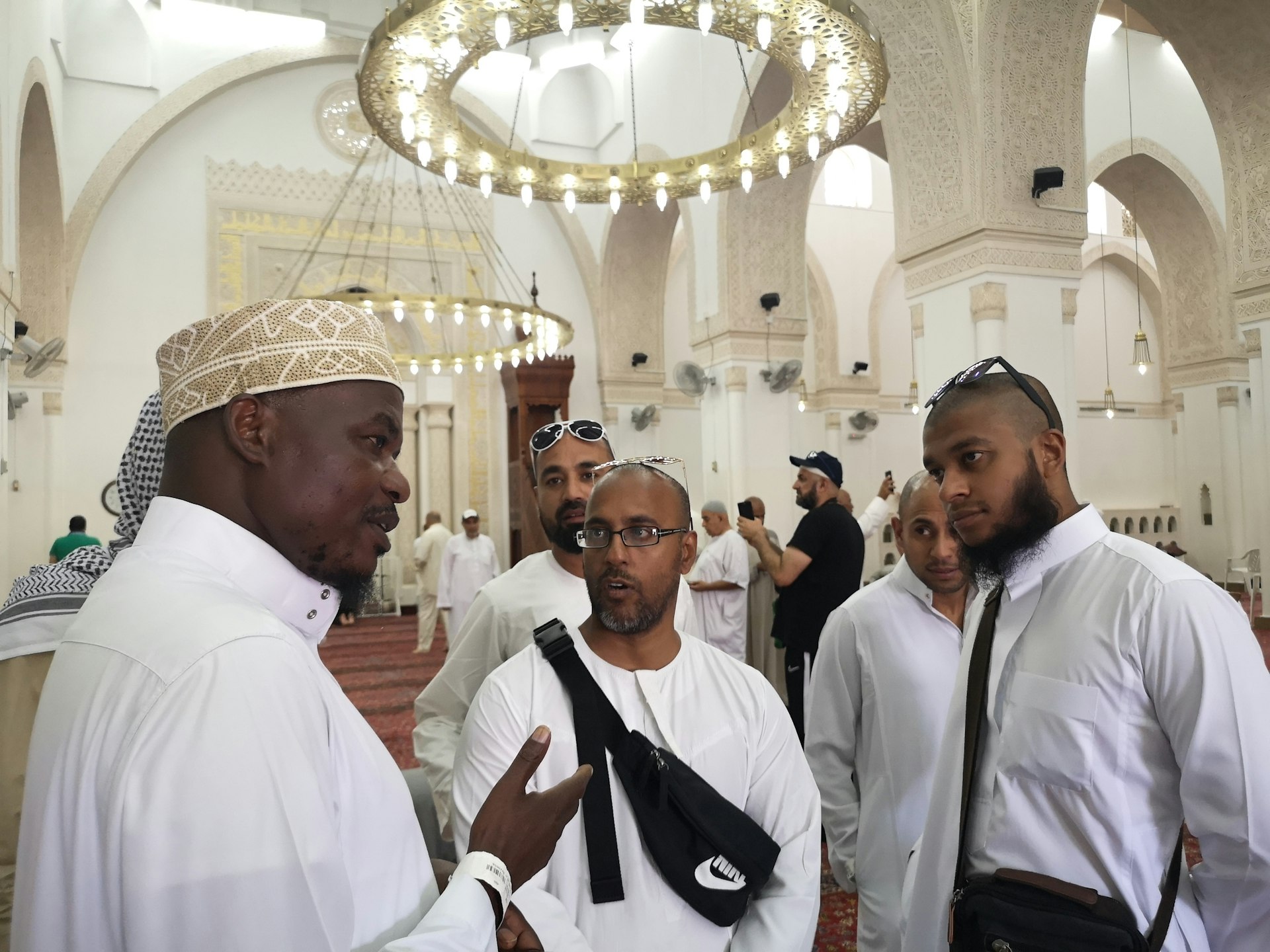Sheikh Suleiman speaks with a group of Hajjis within the mosque