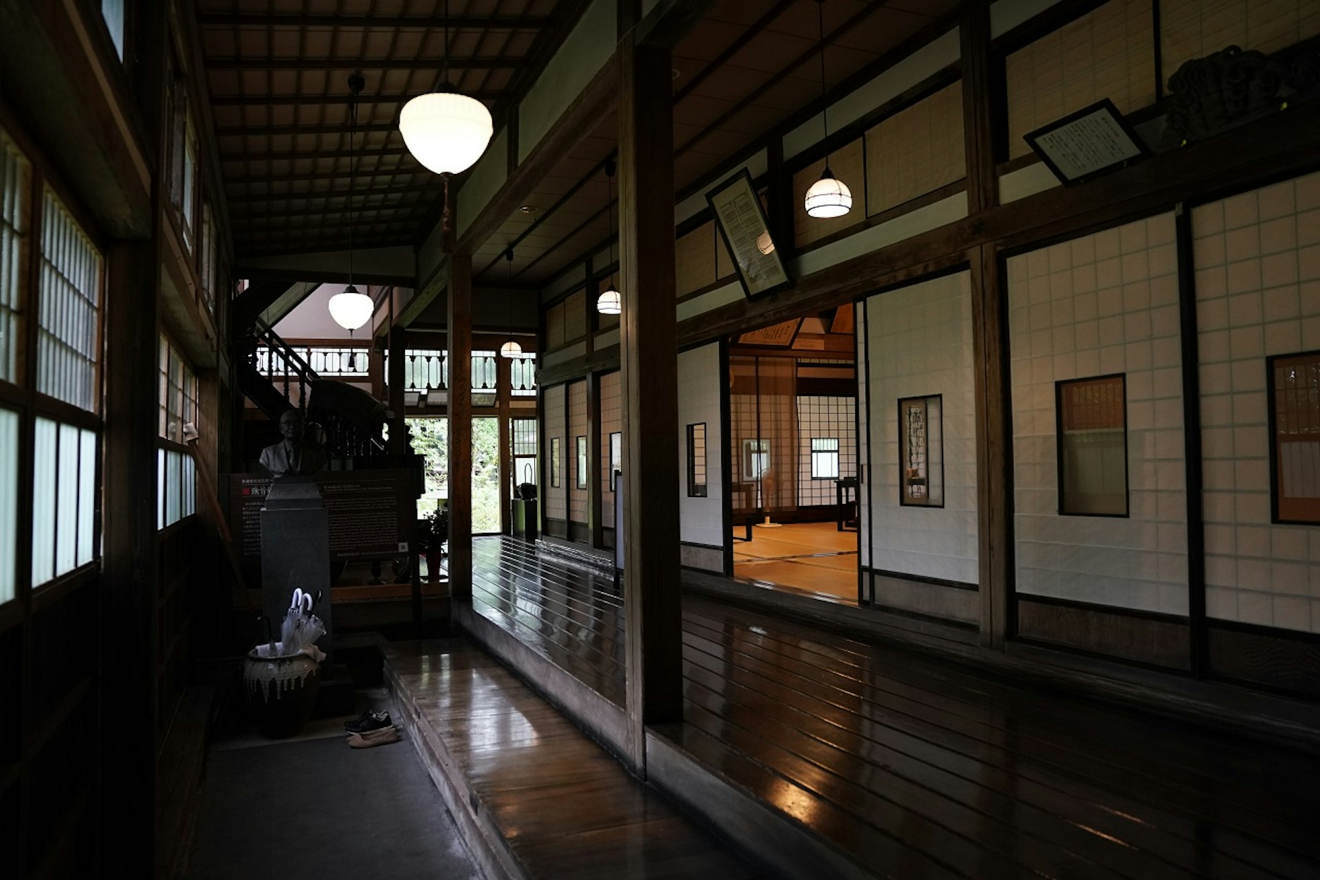 The dark wood interior of the ryokan Shohoen with sliding doors