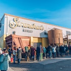 A long line of people wraps around Stranahan's distillery in Denver