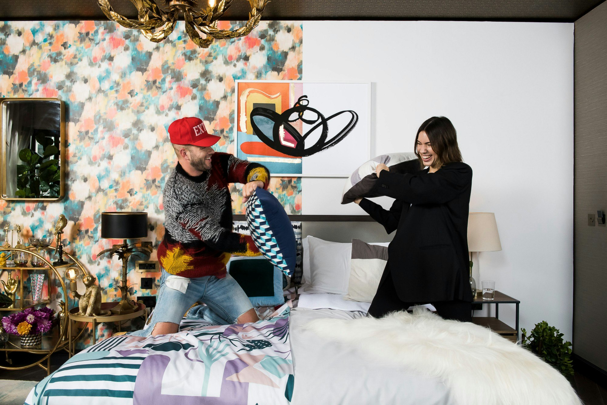 Johnny Wujek and Kaitlyn Ham hang out at the suite they co-designed
