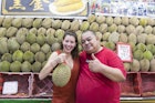 Sofia with durian vendor.jpg