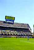 Sporting fans watch two football teams compete at La Bombonera in Buenos Aires