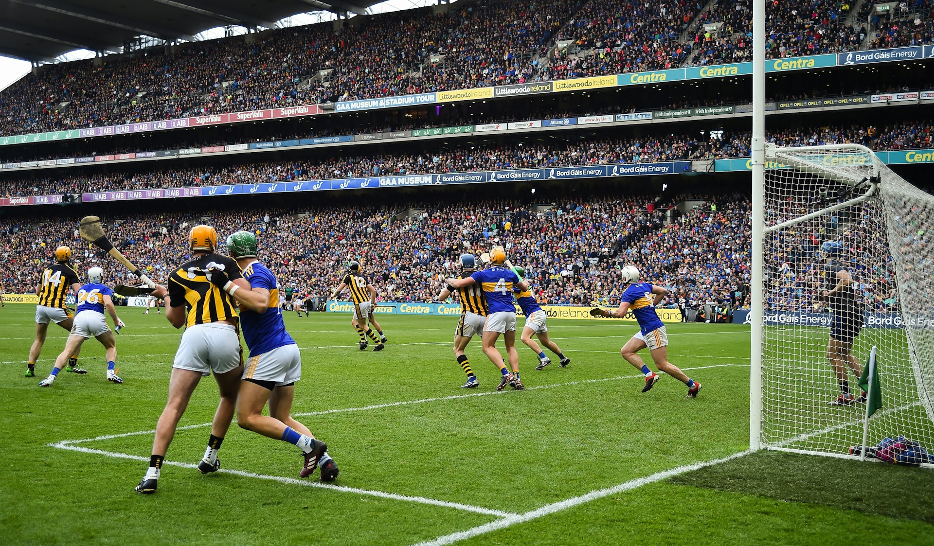 Spectators watch two teams compete in a hurling match at Croke Park, Dublin