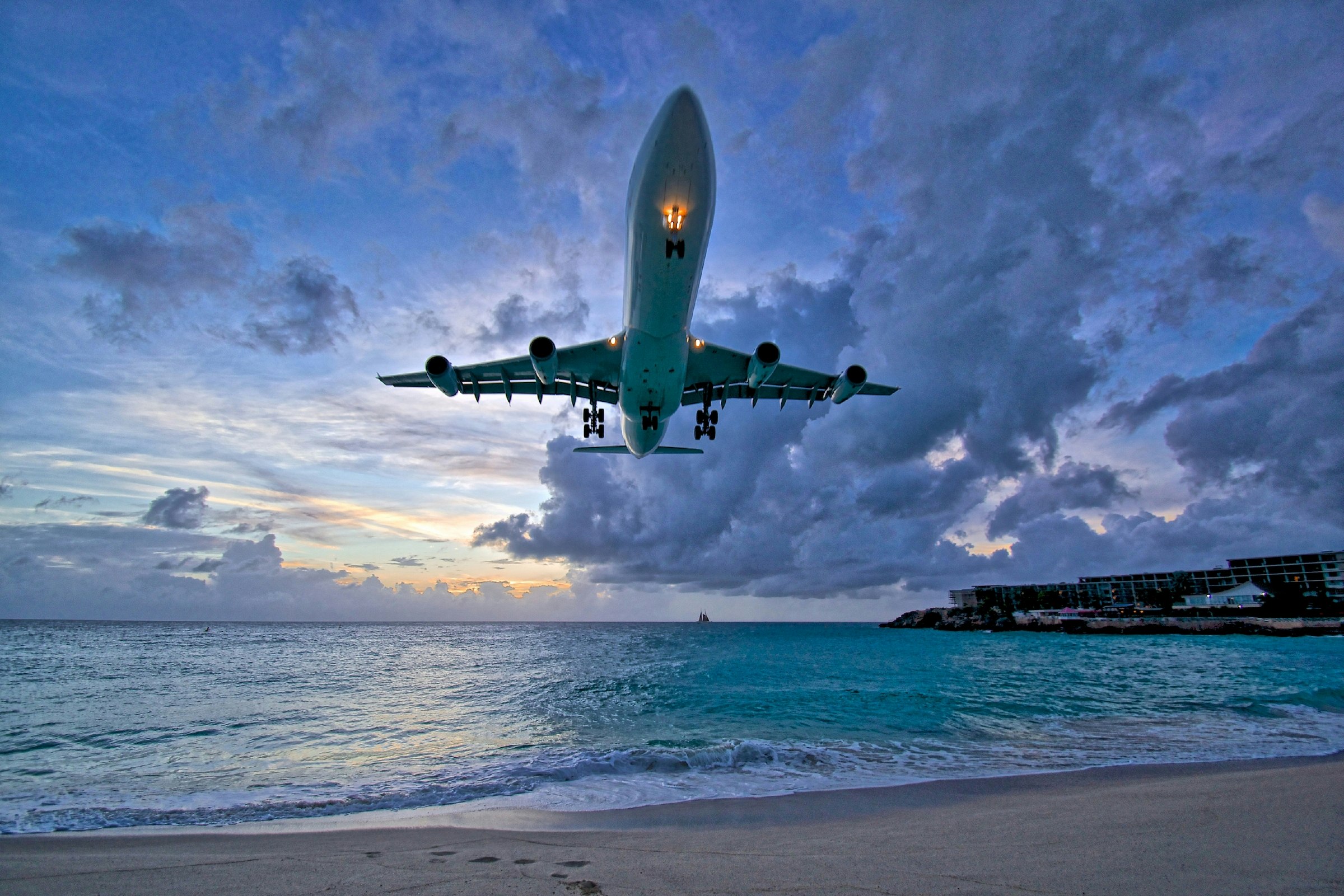 Air France A340 landing at Princess Juliana International Airport (PJIA) at sunset on St.Maarten. 