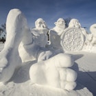 Large snow sculptures in the likeness of ogres and a dragon are on display at the St. Paul Winter Carnival.
