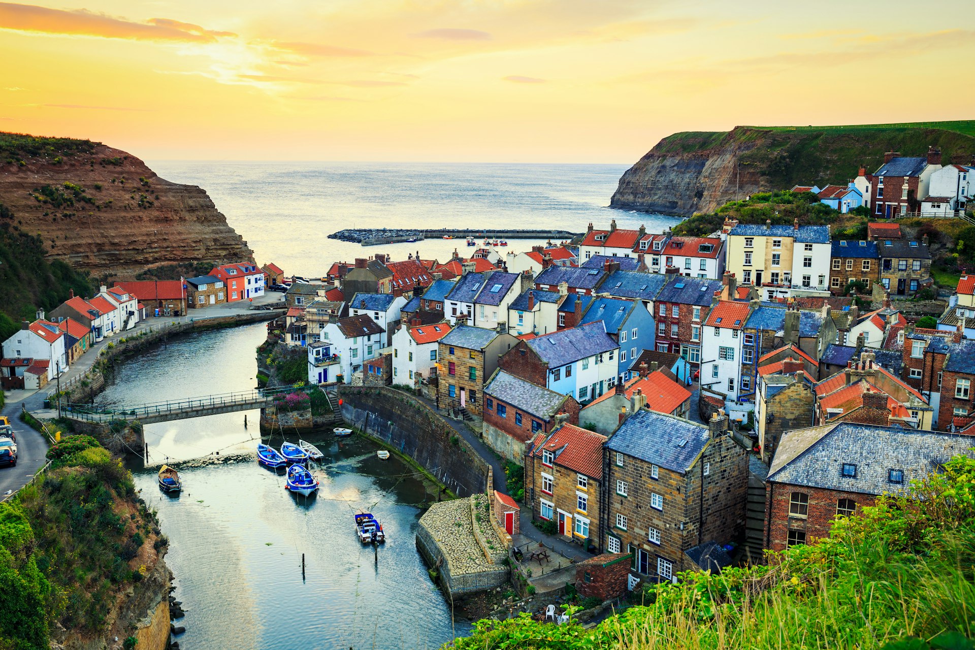 Sunrise over the colourful seaside village of Staithes