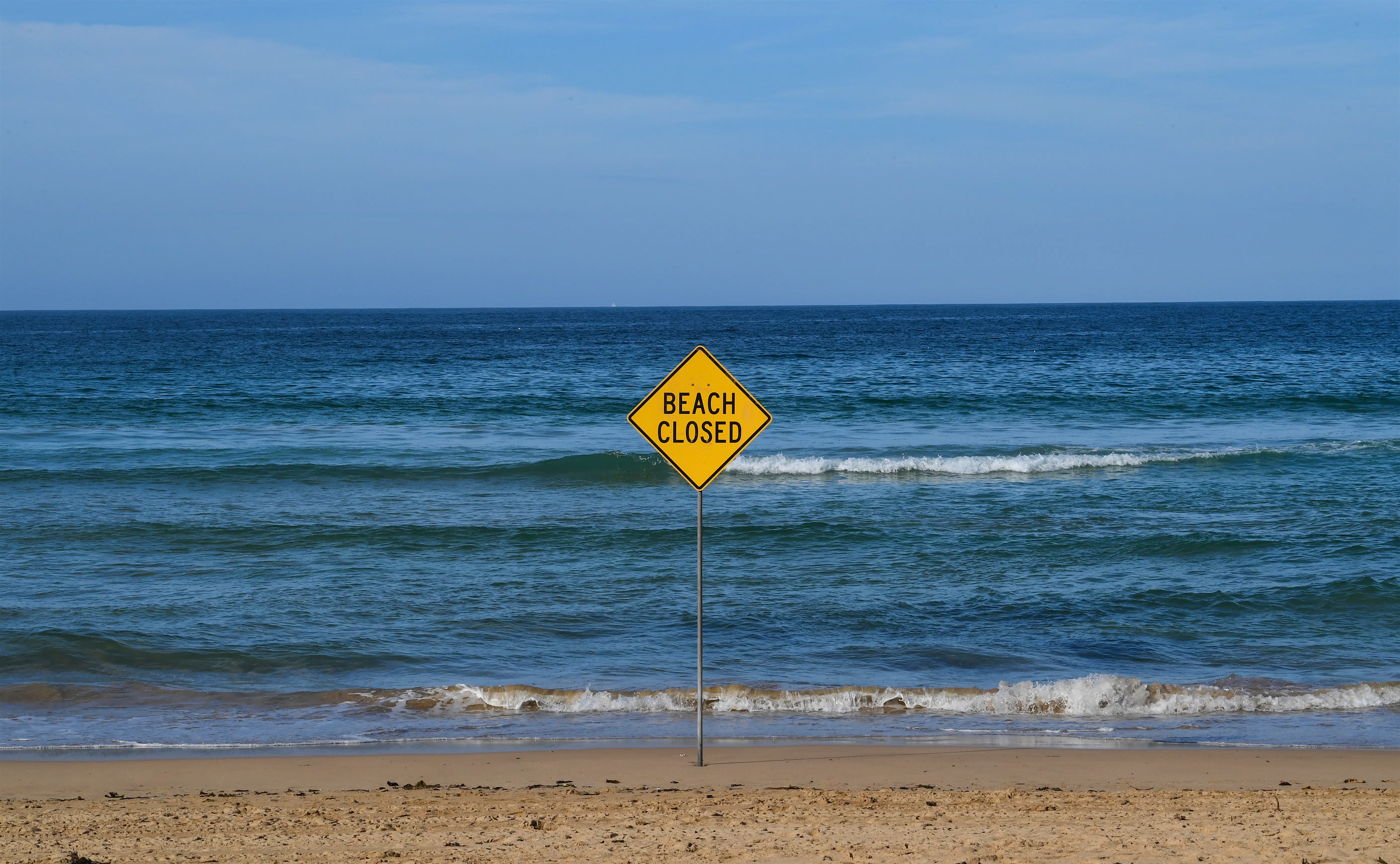 Sydney shutdown.jpg A beach closed sign on Manly Beach on March 22