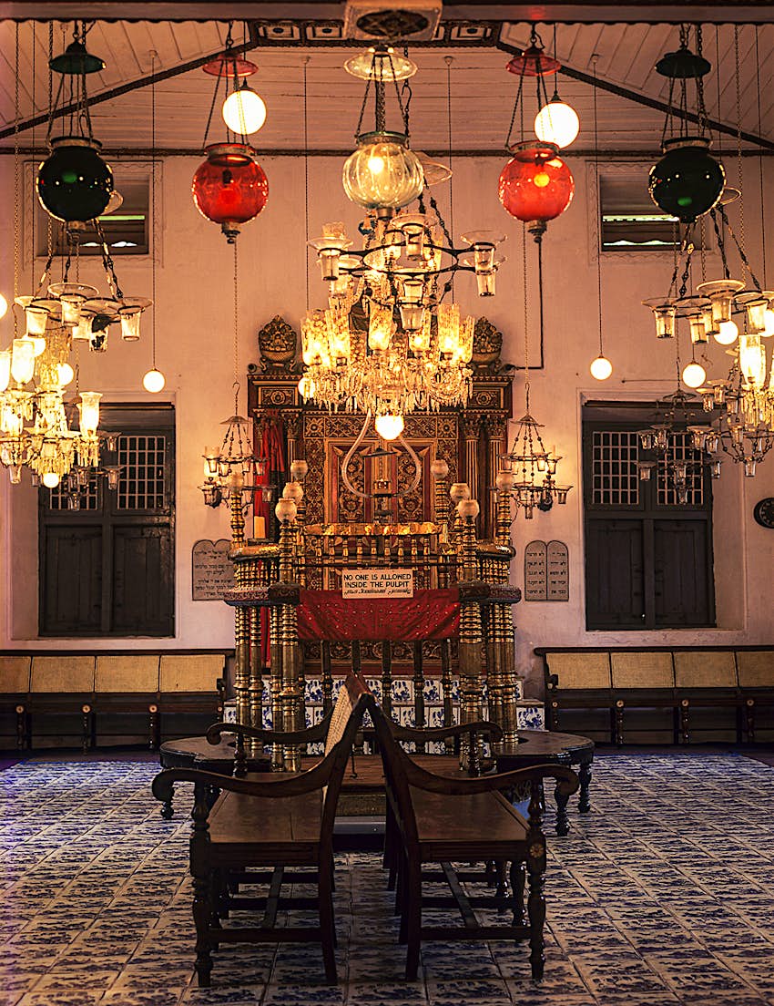 Synagogue_Kochi_India-05d7b1584315.jpg The interior of a synagogue featuring glass globe lanterns, chandeliers, and tiled floors. Kochi, India.