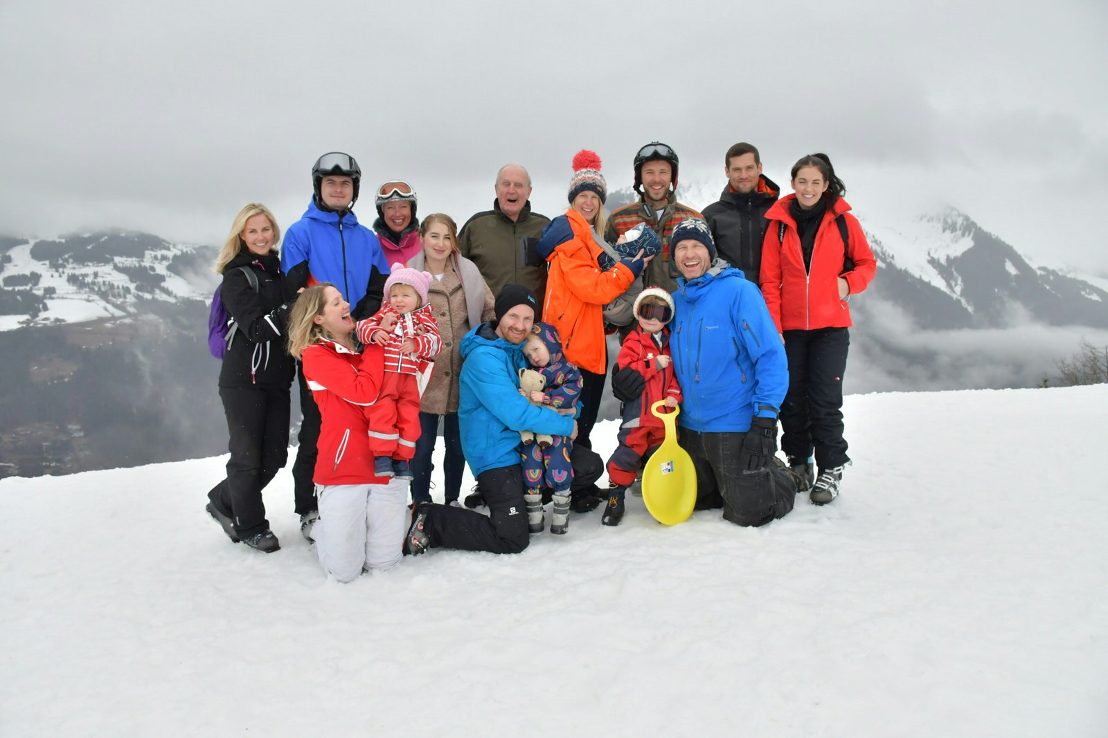 The Cole family in Morzine, France on a snowy mountain wearing ski gear