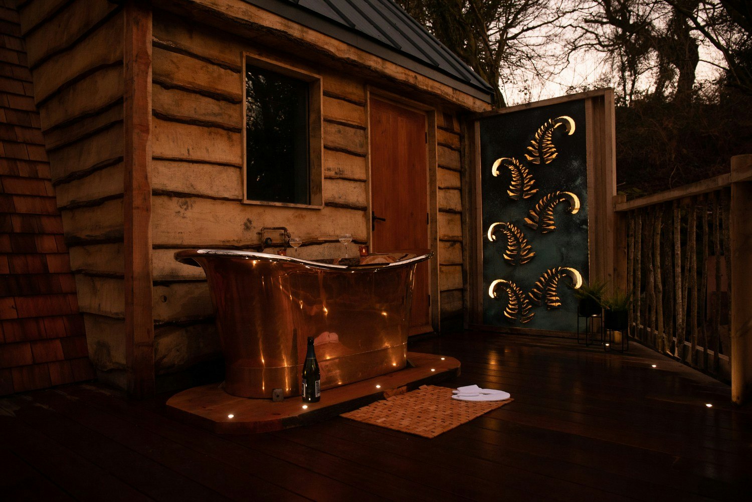 A copper bathtub outsde a treehouse 3.jpg
