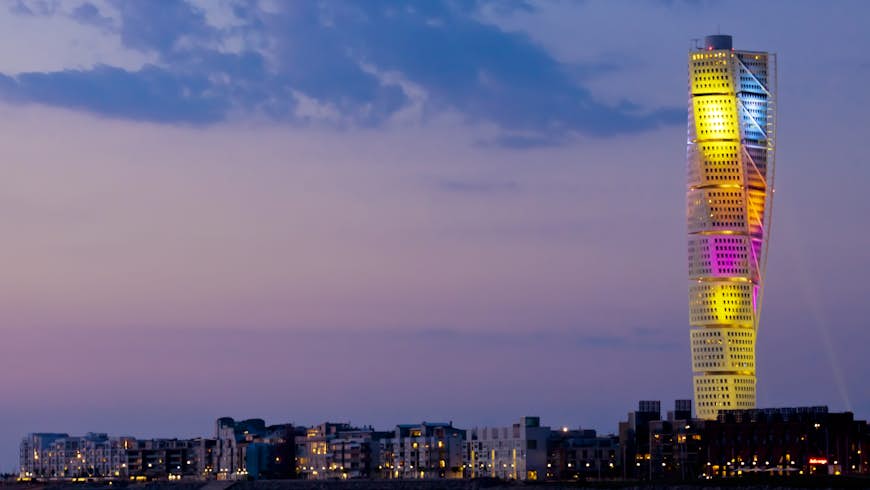 The skyline of Malmo, Sweden. The brightly-lit Turning Torso building is visible. 