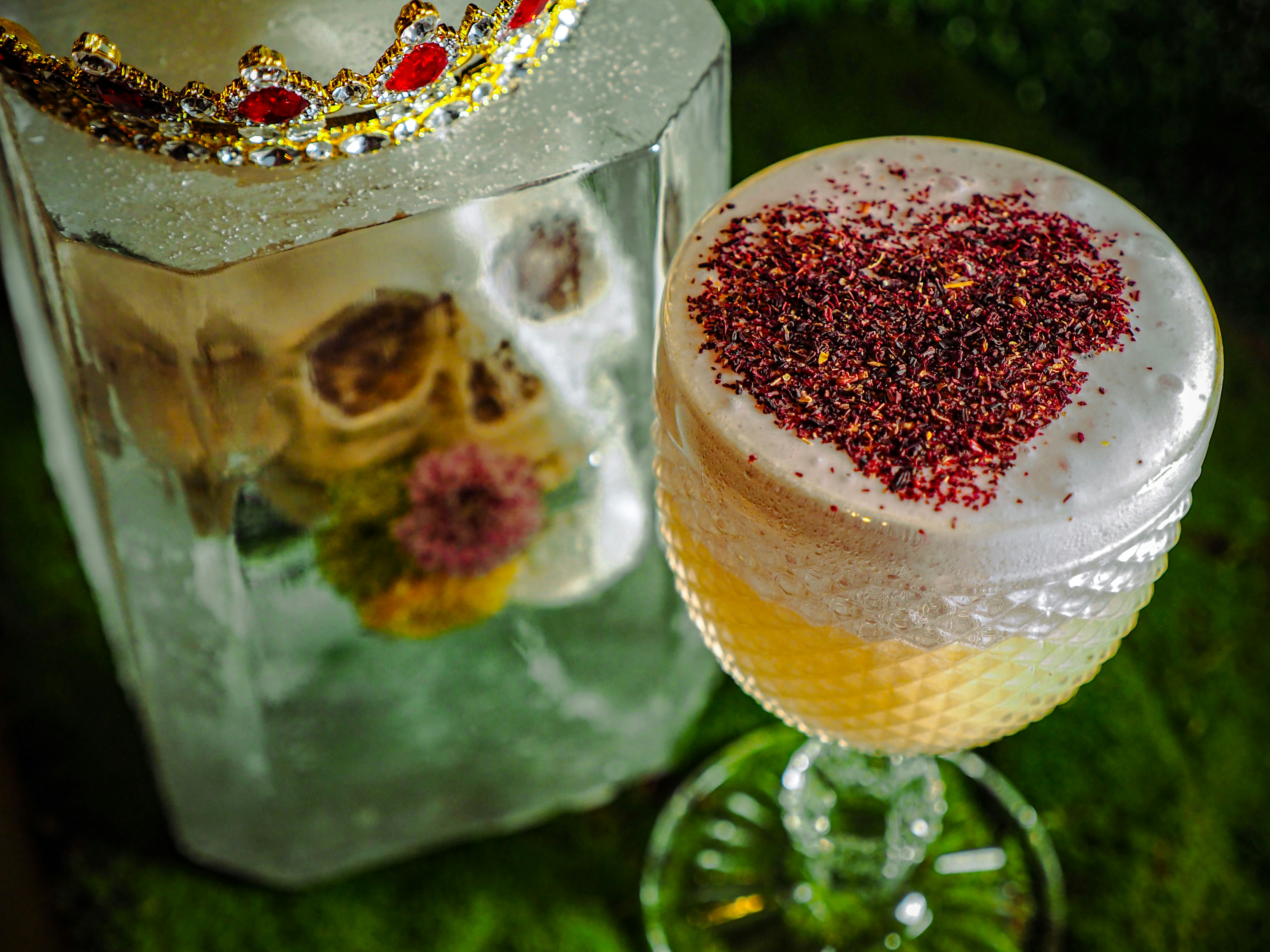 A cocktail with a stenciled heart on top