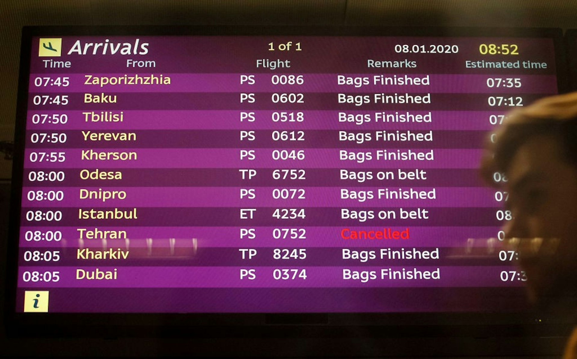 An electronic board with information on flights, including the one from Tehran marked as cancelled is seen at the International Airport Boryspil in Kyiv. .jpg