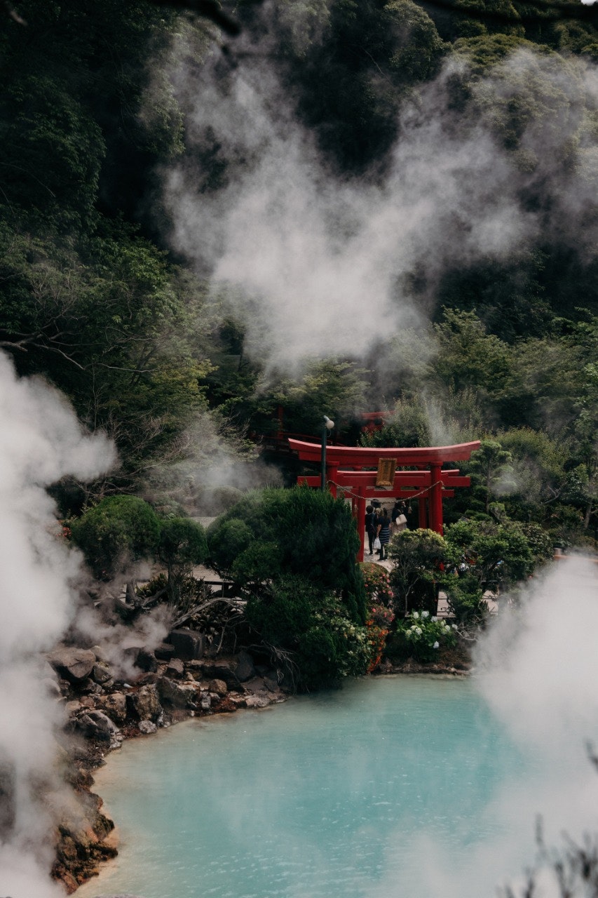 Steam rising from the turquoise Umi Jigoku hot spring