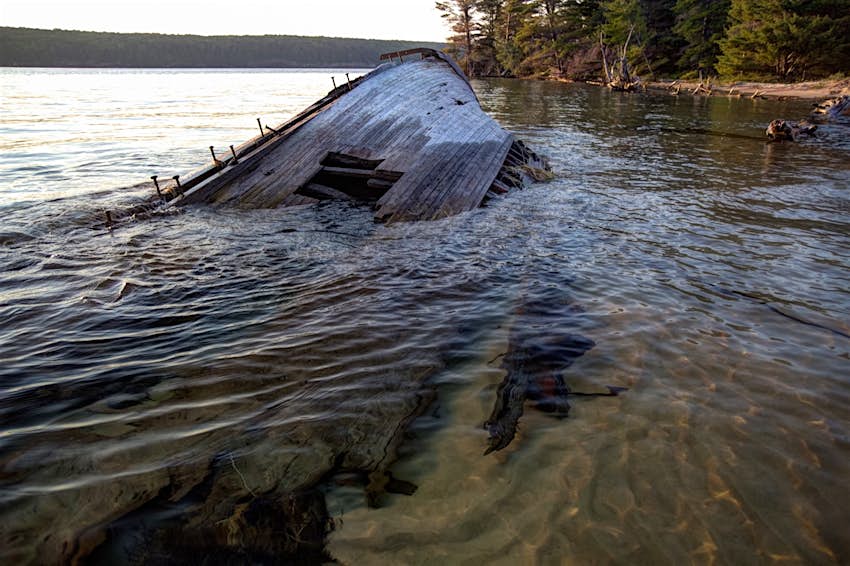 A shipwreck pokes from the water of Lake Superior in the upper peninsula of Michigan; Great Lakes road trip
