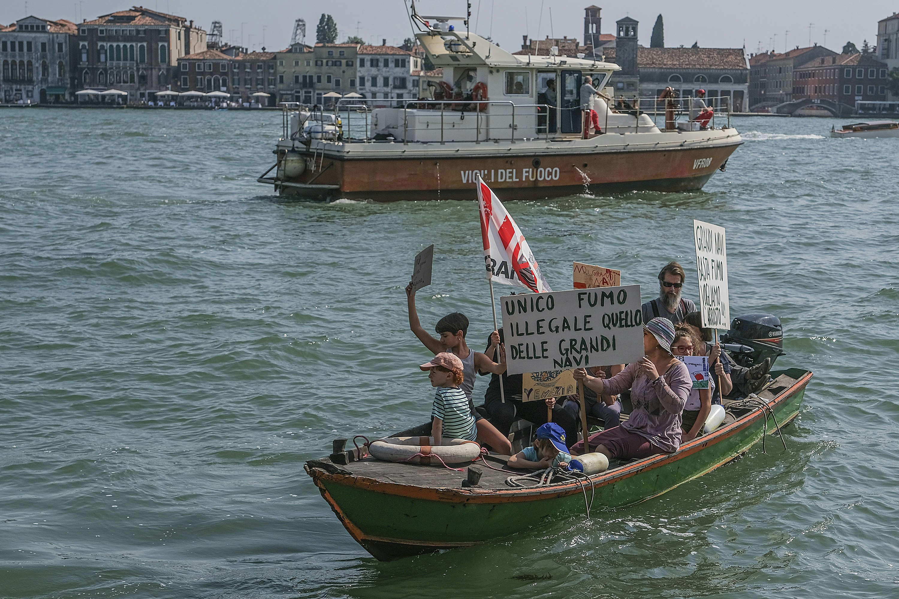 Venetians in kayaks protest against cruise ships after accidenton June 08, 2019 in Venice, Italy. Following the incident of the cruise ship Opera, of the company MSC, which occurred on 02 June 2019, the No Big Ships committee organized a protest march in Venice asking for the passage of large ships near San Marco to be banned. 