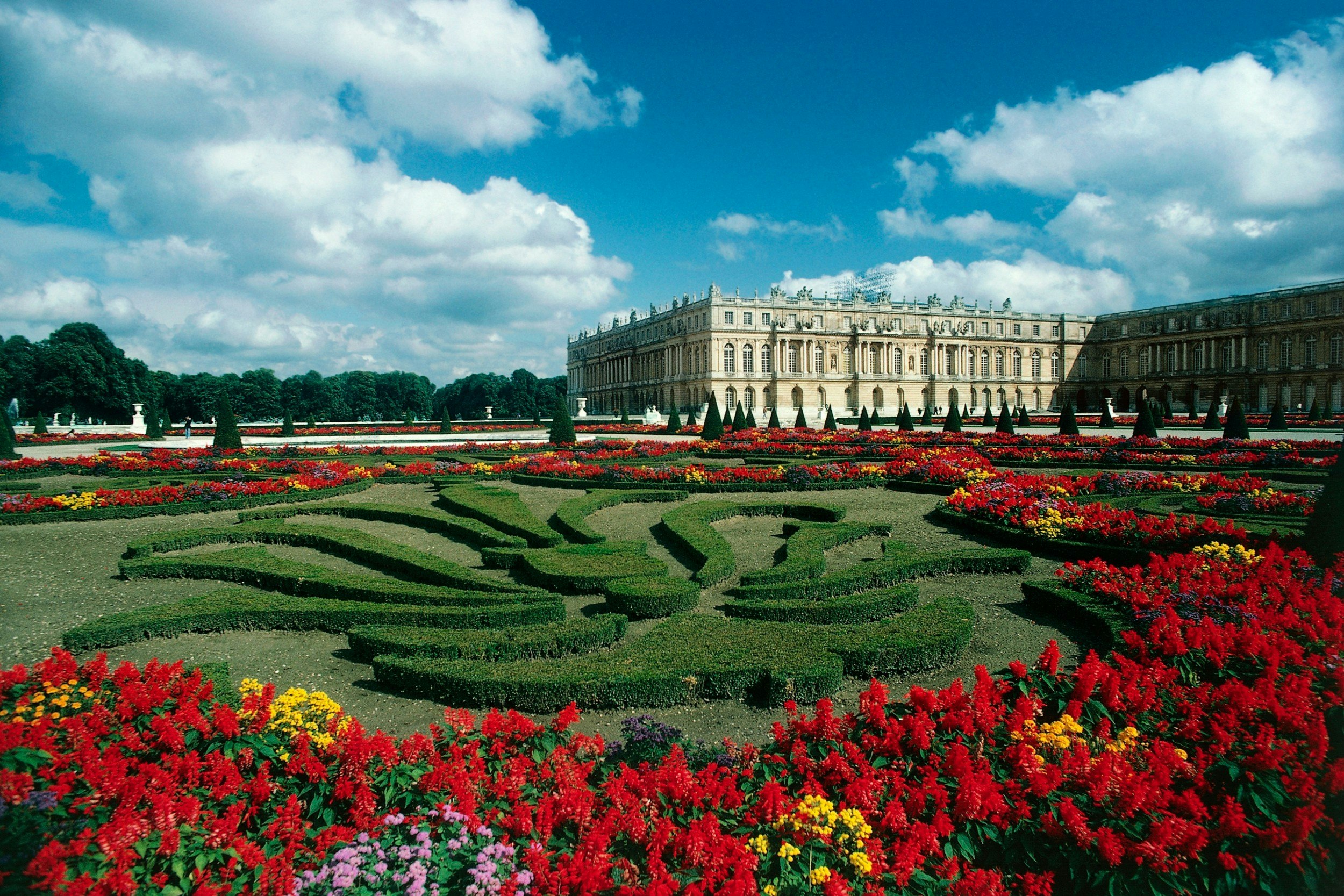View of the Palace of Versailles in France, with its gardens in full bloom
