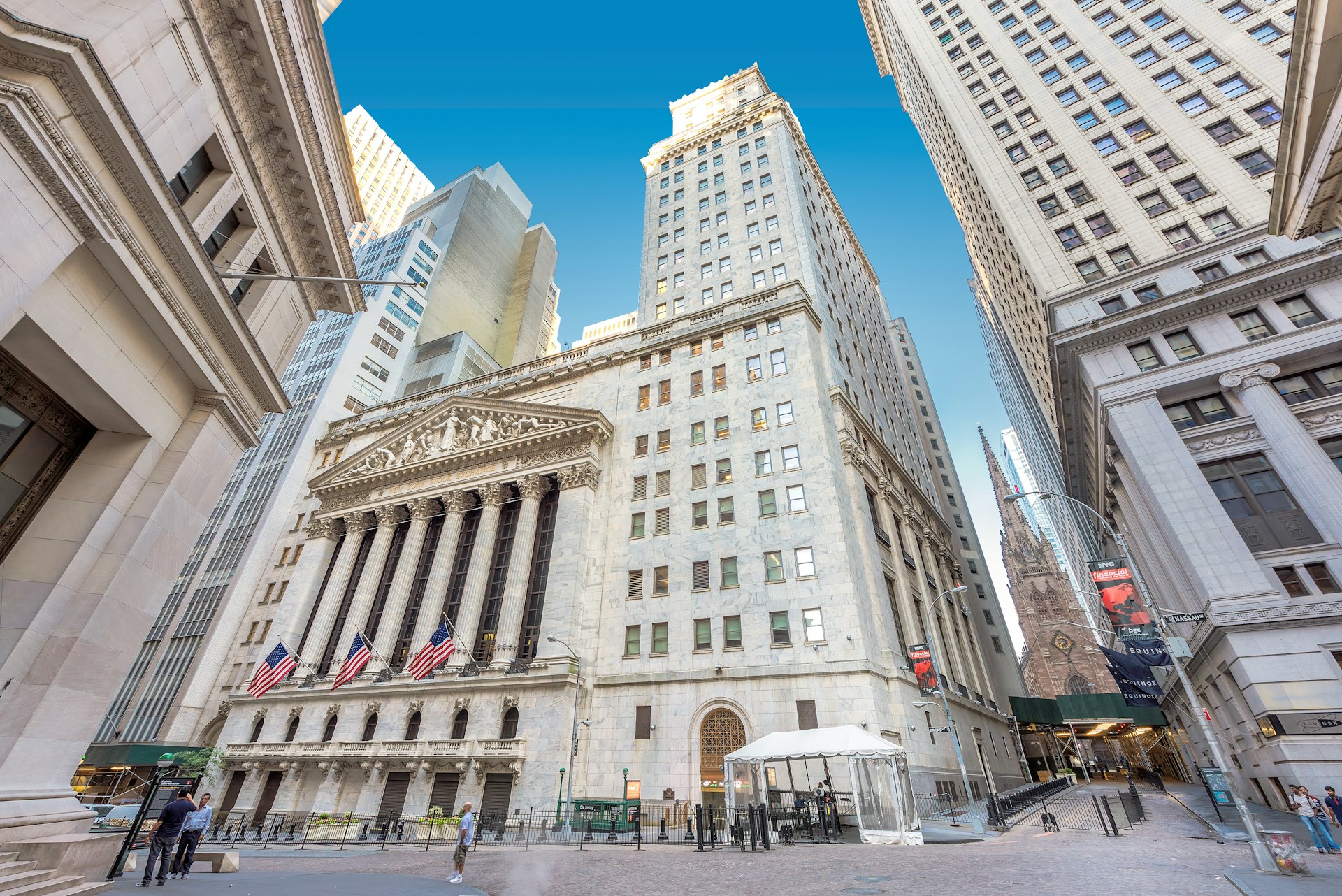 A view of Wall Street and New York Stock Exchange on a sunny day 