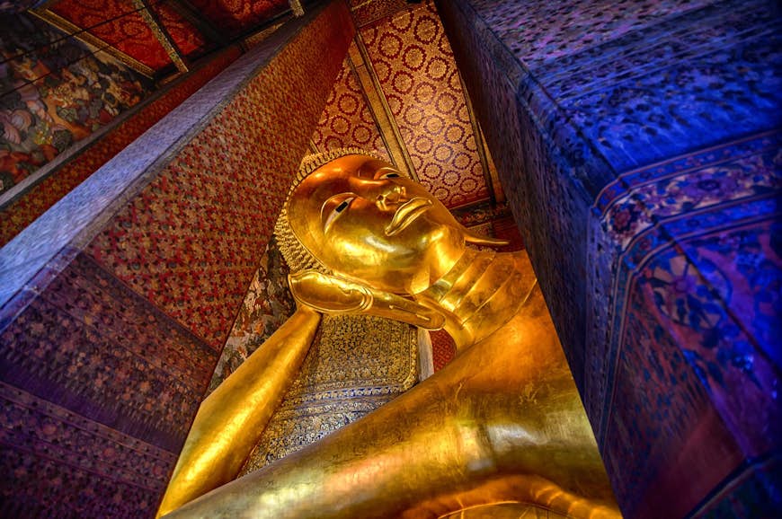 Close up of a reclining Buddha in gold