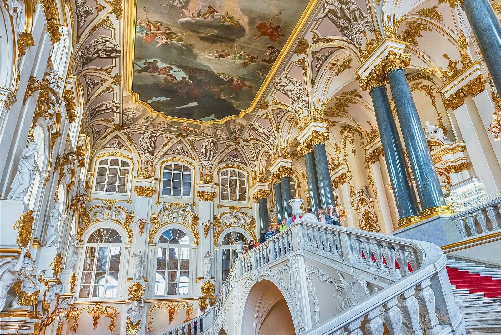 The ornate gilded Jordan Staircase of the Winter Palace at the Hermitage Museum in St Petersburg, Russia; above is a frescoed ceiling.