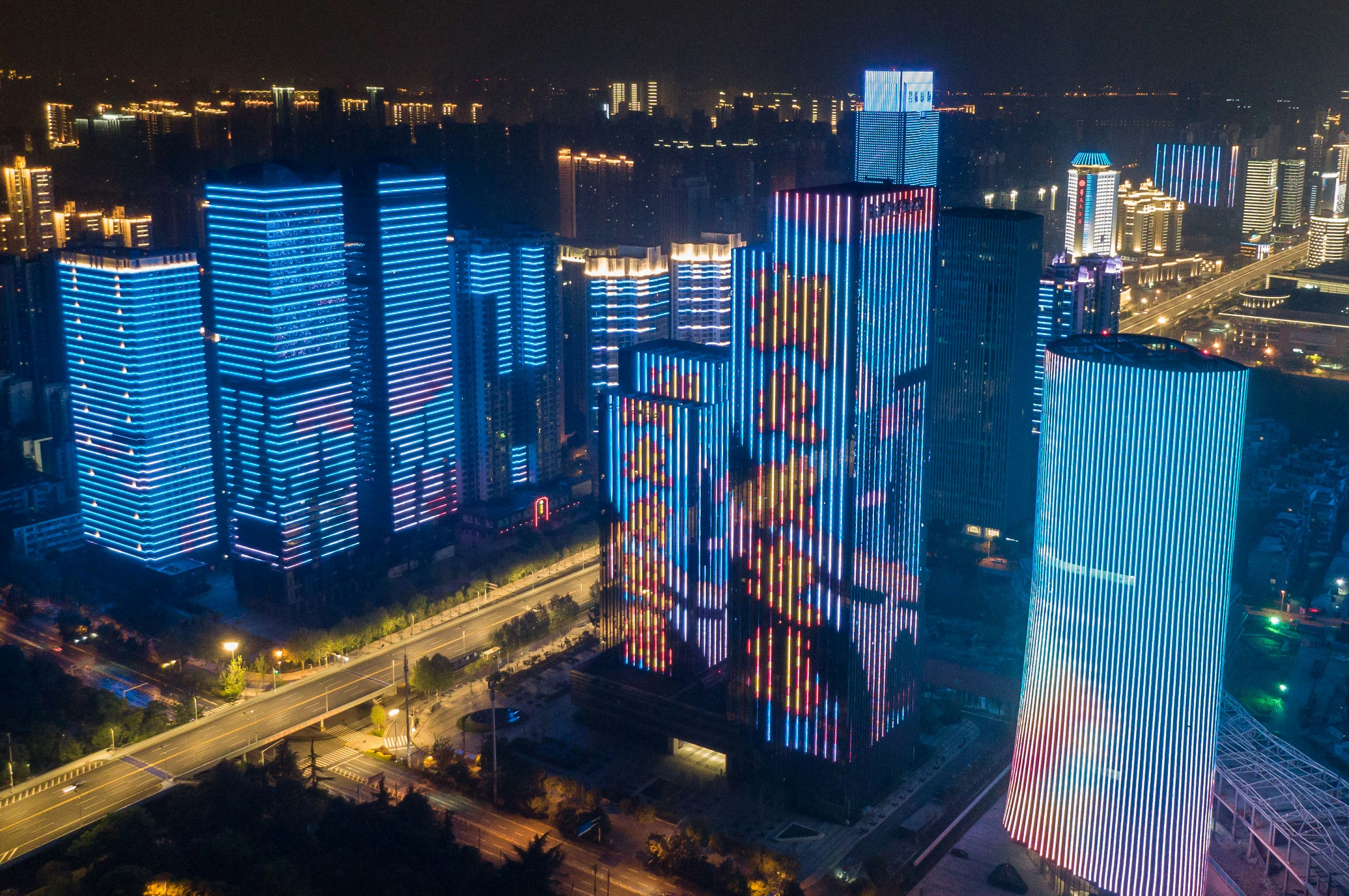 Aerial photo taken on April 8, 2020 shows illuminated buildings in Wuhan