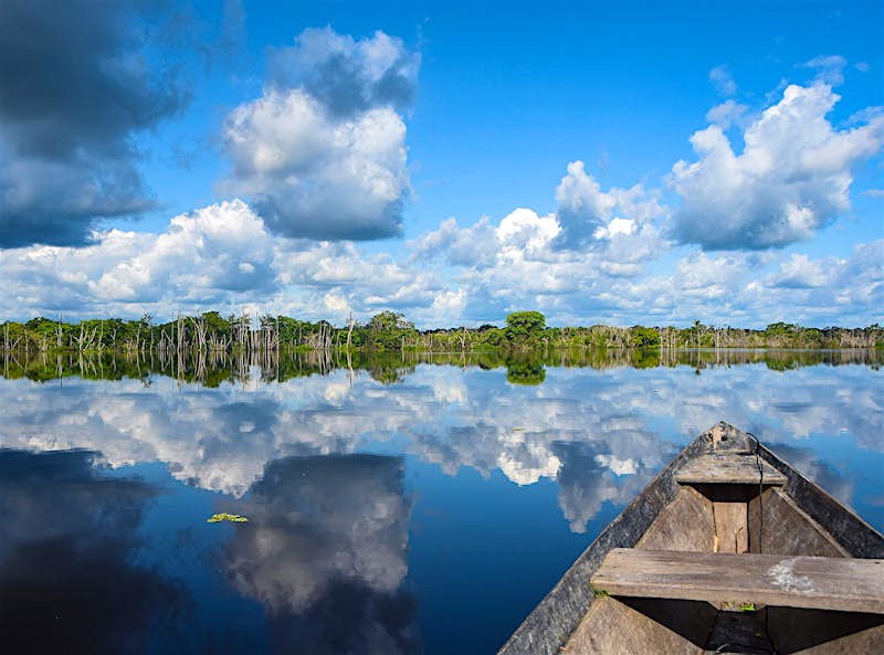 Xixuaú_AnthonyHam-9a9660b1166d.jpg A view of the still water of Xixuau from a wooden canoe.