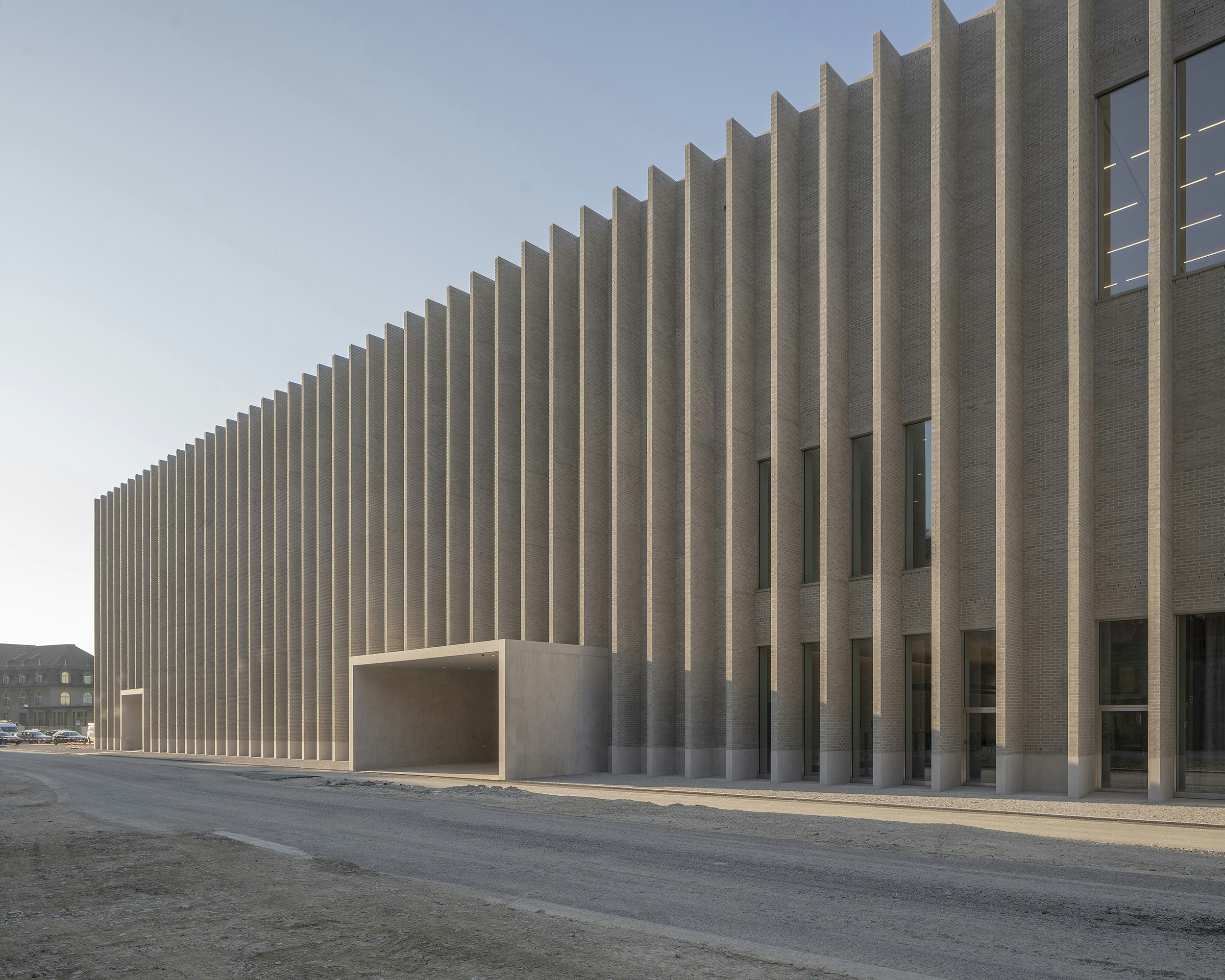 Sleek grey exterior of the MCBA Plateforme 10 building