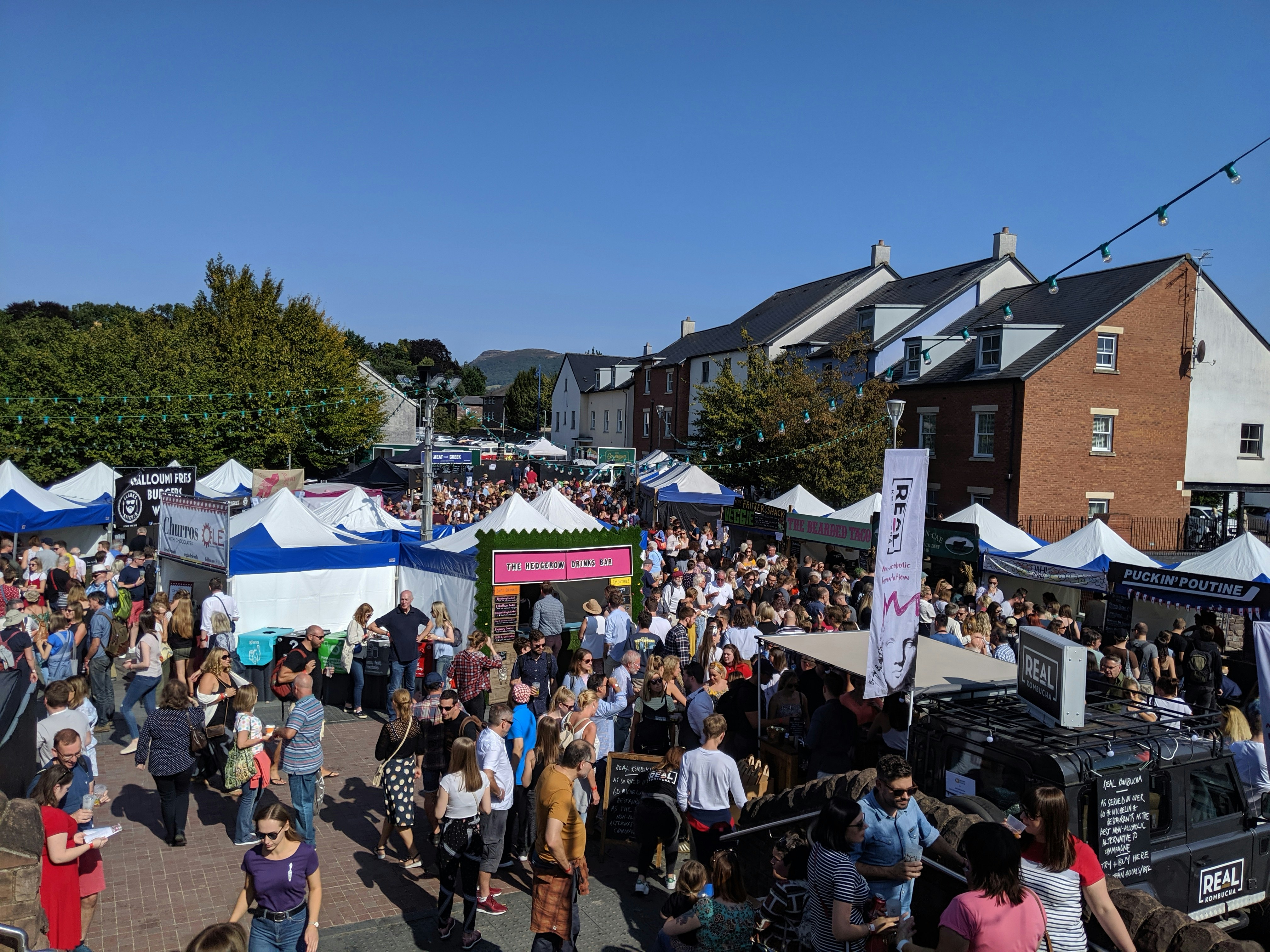 Multiple food stalls and crowds fill the streets of Abergavenny during the annual food festival
