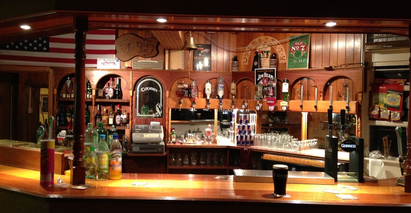 A pub interior shows off the alcohol collection at the bar. 