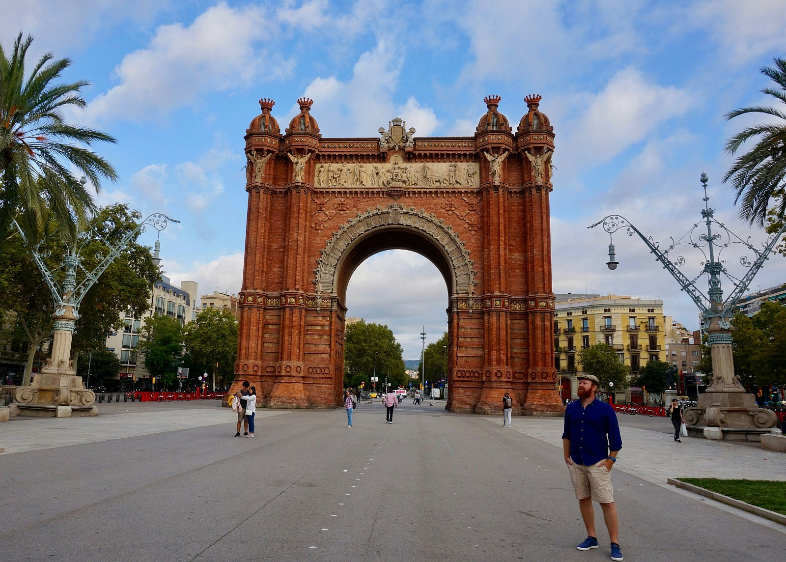 Writer Daniel poses in front of Arc de Triomf in Barcelona, Spain