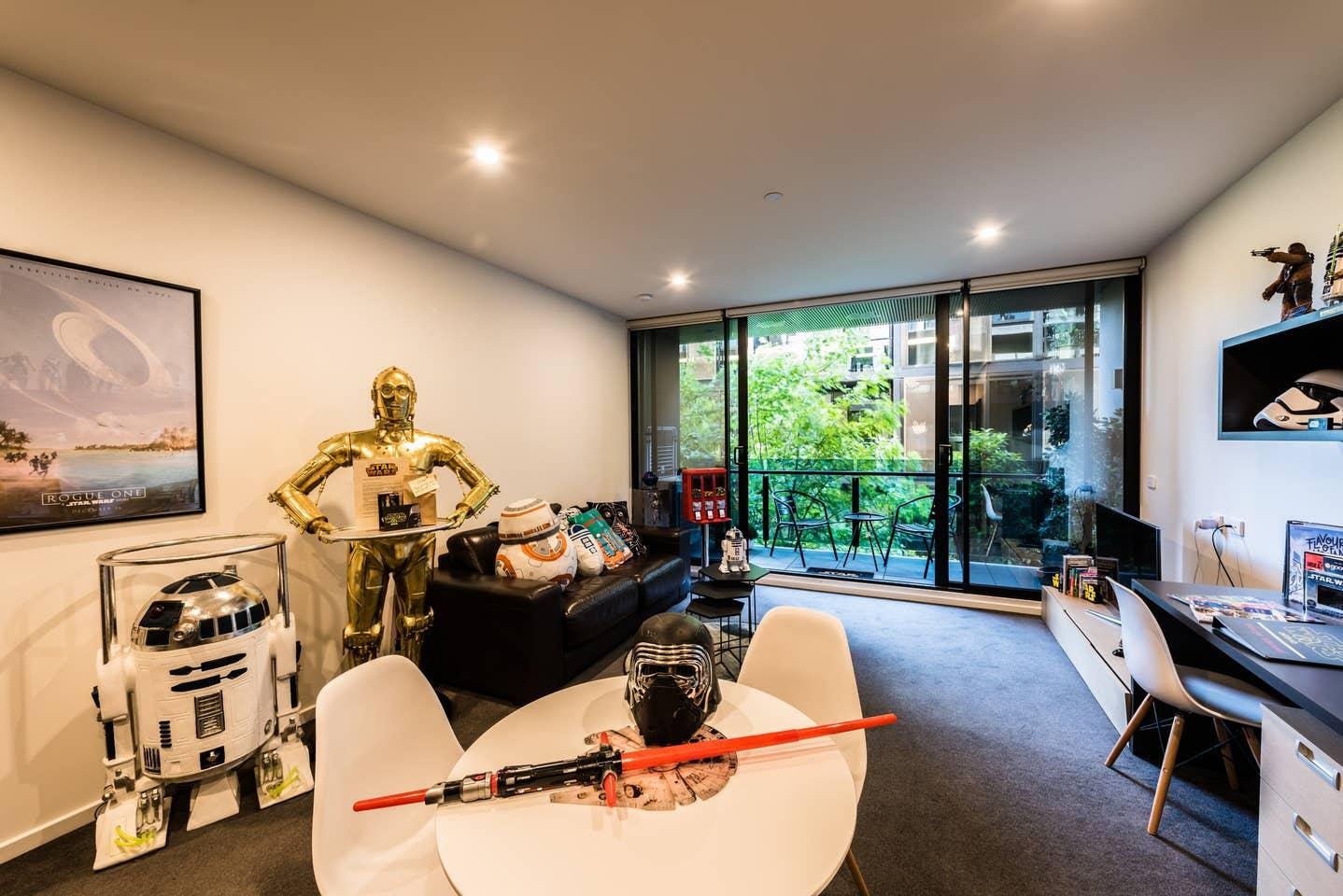 A picture of the living room in the Melbourne house featuring tons of Star Wars memorabilia