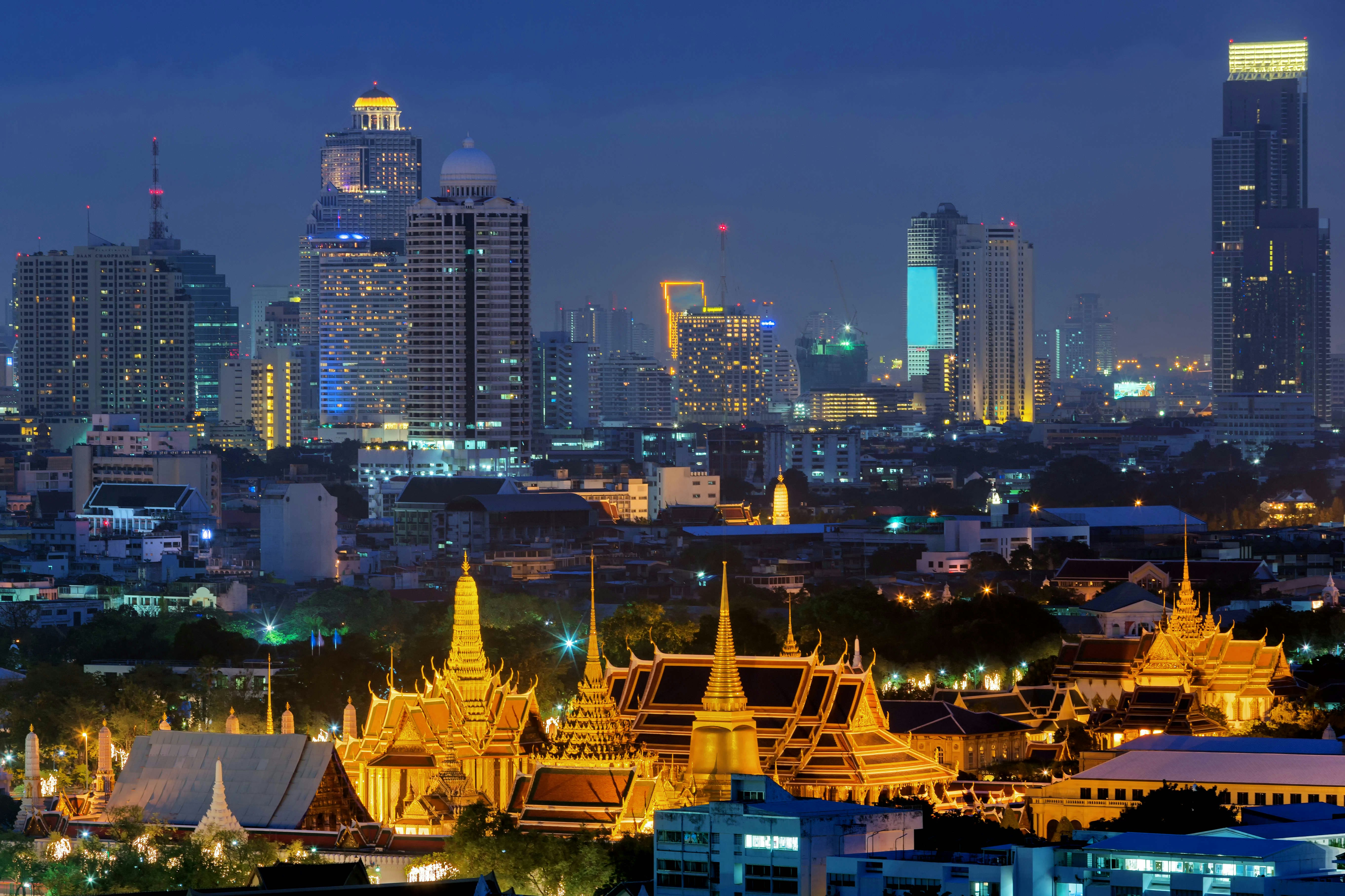 A picture of Bangkok's palace illuminated at night