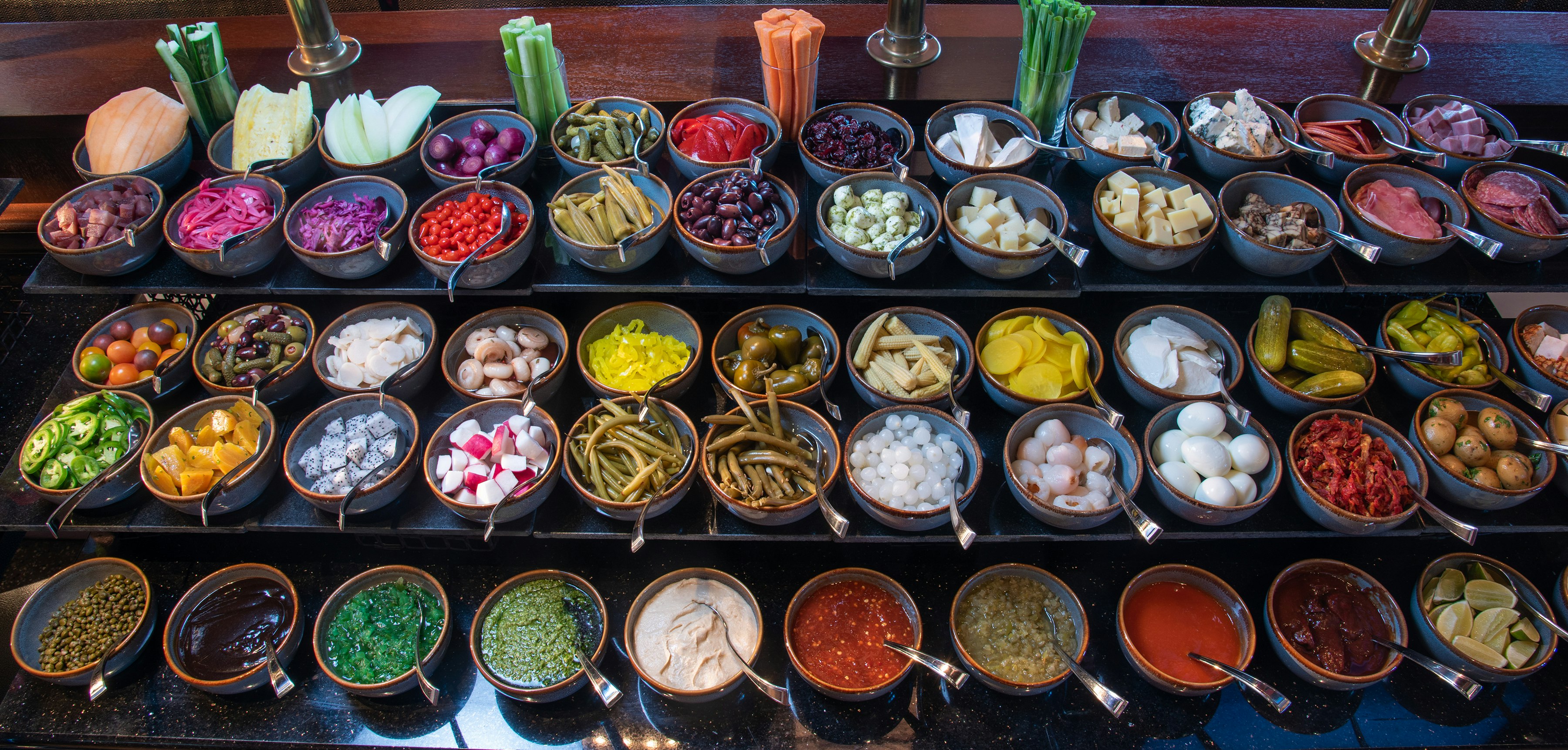 A shot of the complete toppings section of the Bloody Mary bar