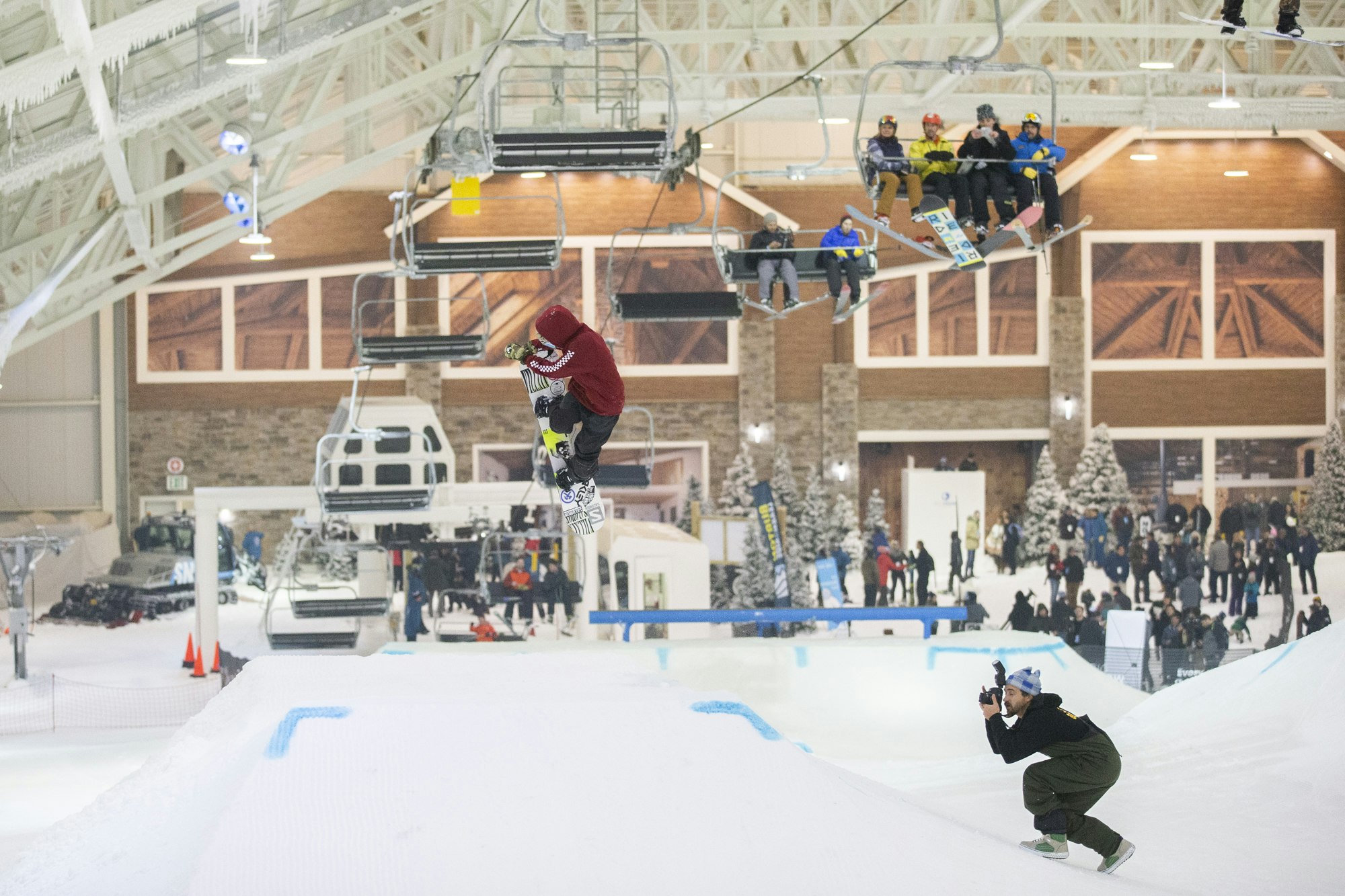 A picture of the slopes at Big SNOW with a snowboarder performing a trick