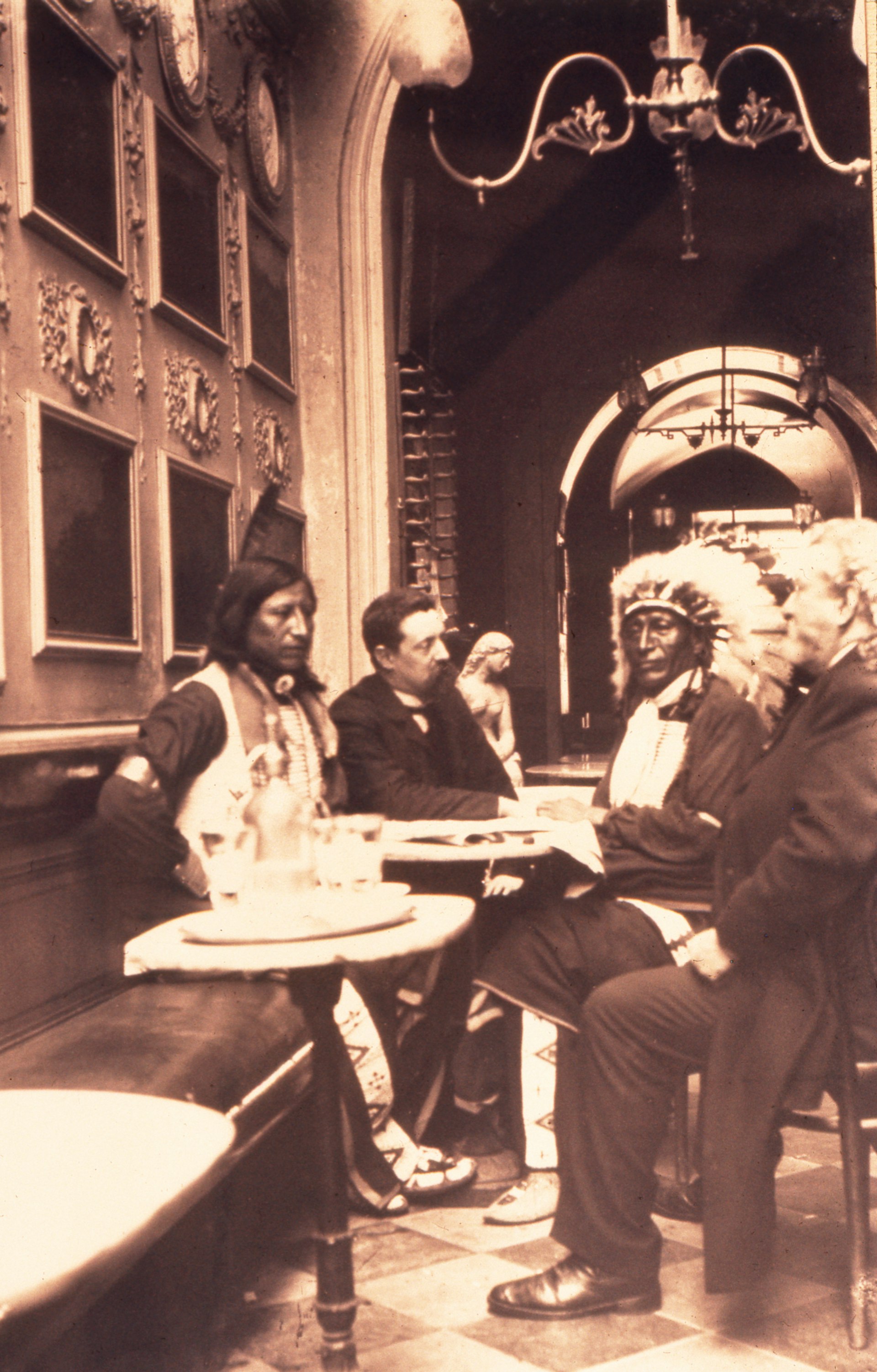 An archive picture of Buffalo Bill sitting at one of Caffé Greco's tables