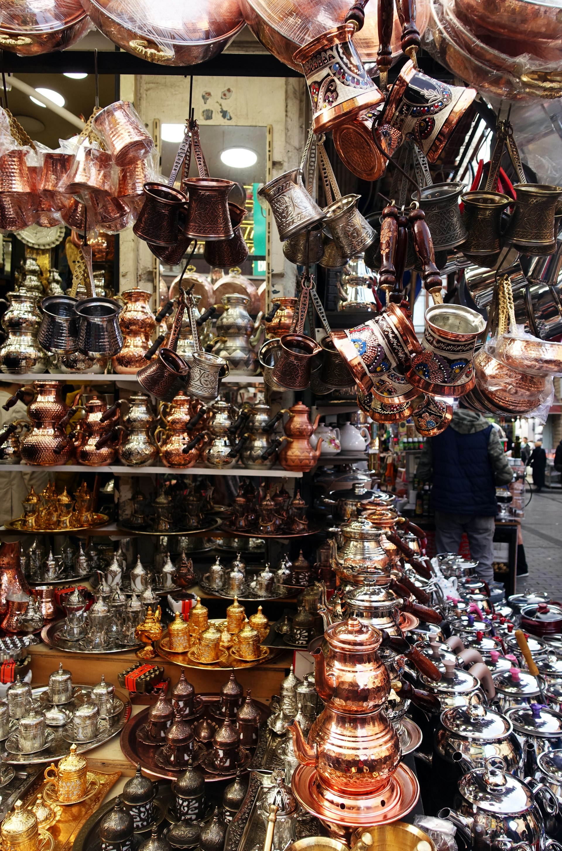Cezves and turkish coffee cups hanging in a shop in Turkey
