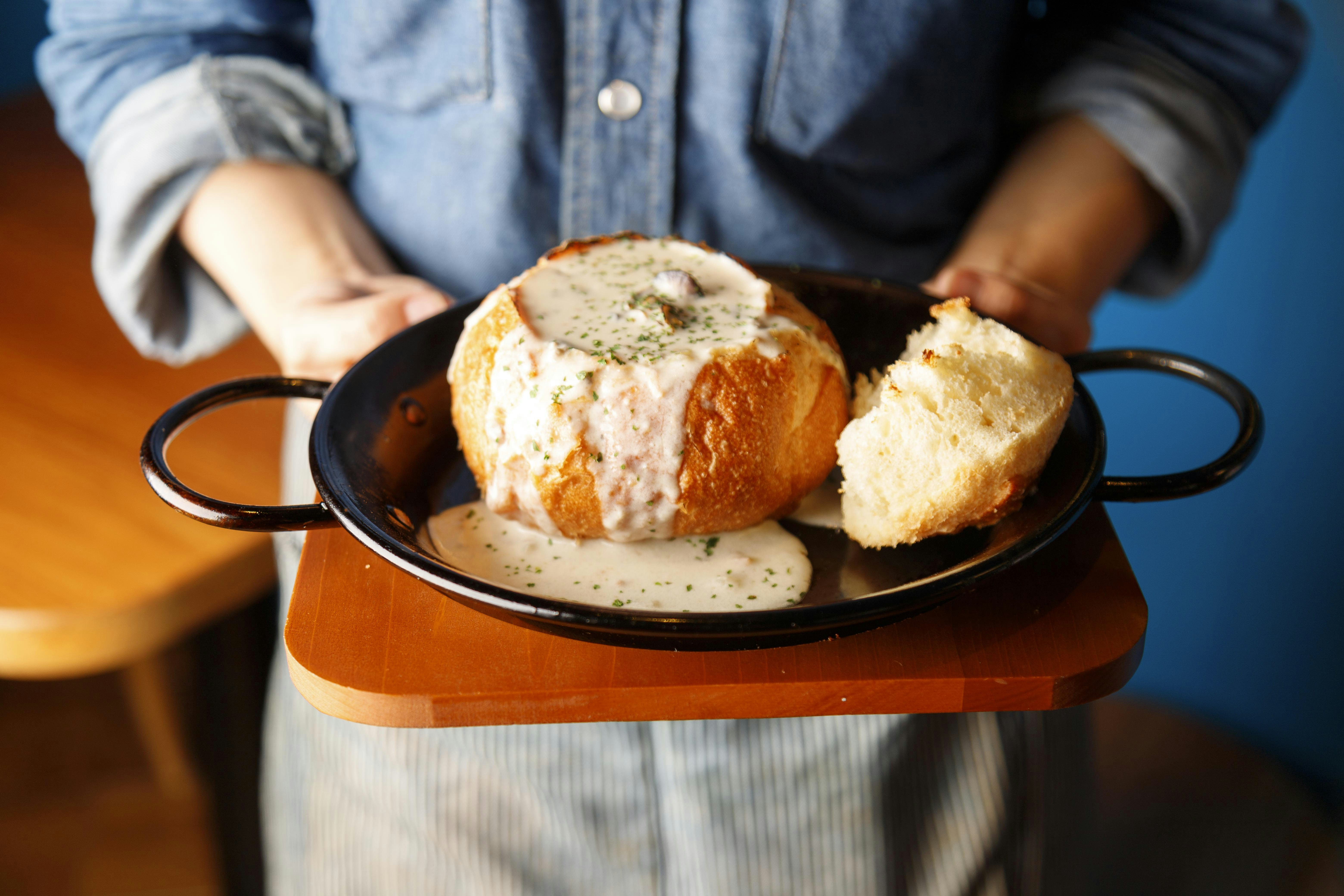Clam chowder in a bread bowl. 