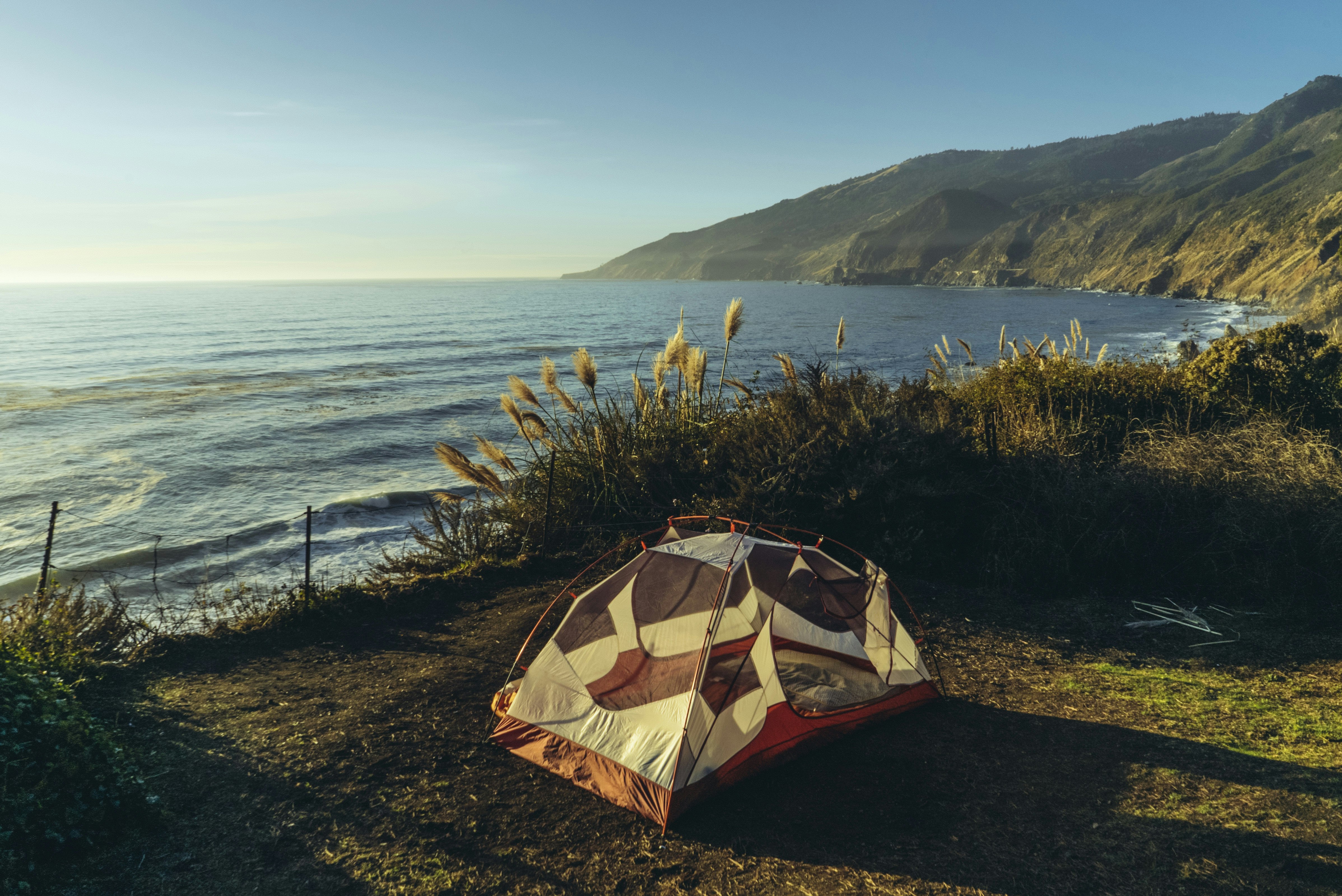 A tent pitched in a coastal park