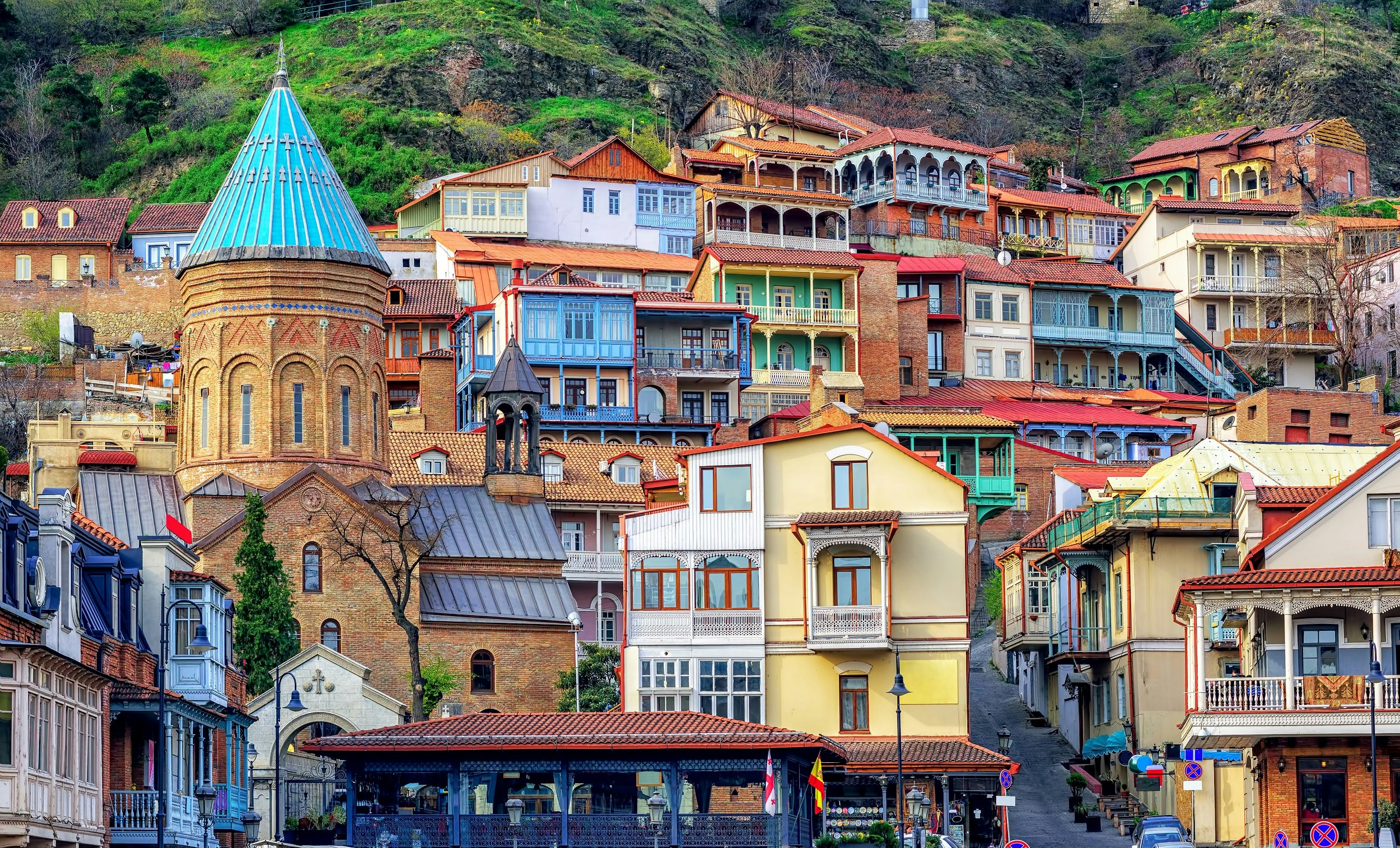 Wooden houses cover the hillside, all painted in lovely pastel colours.