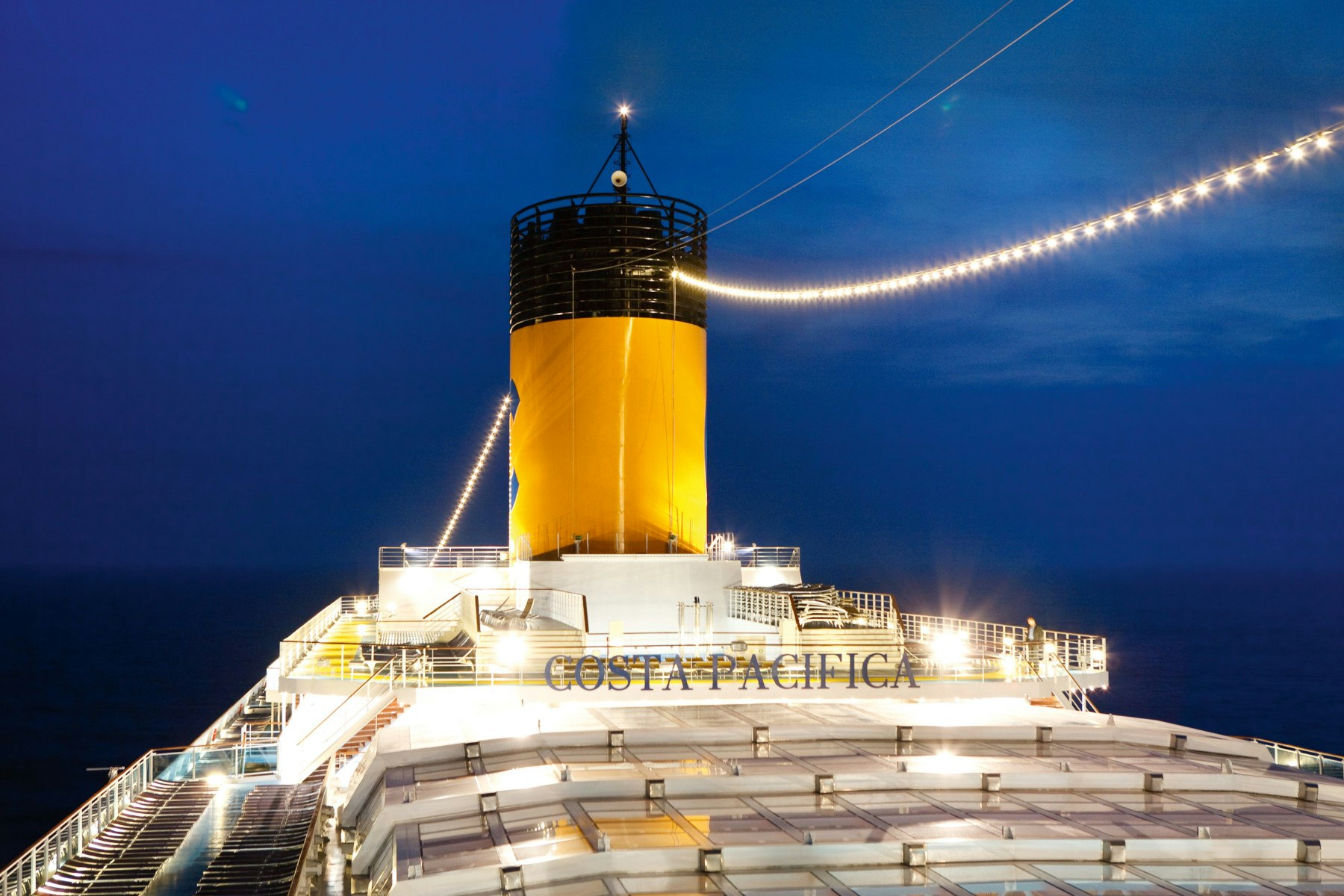 A shot of the name of Costa Pacifica written just under the ship's chimney