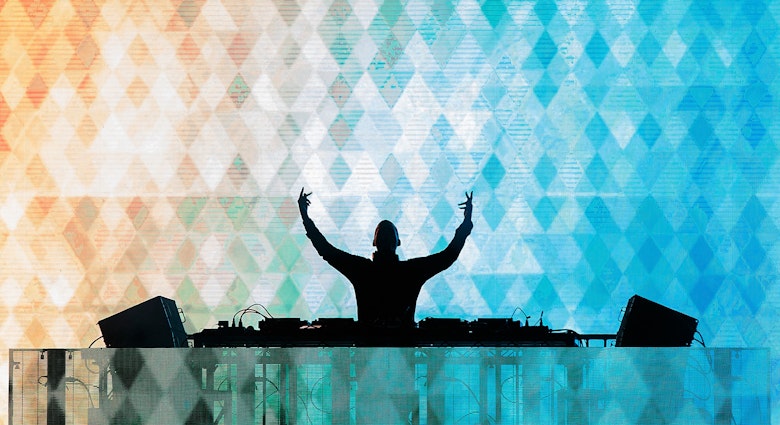 dj with hands up editorial only_crop.jpg