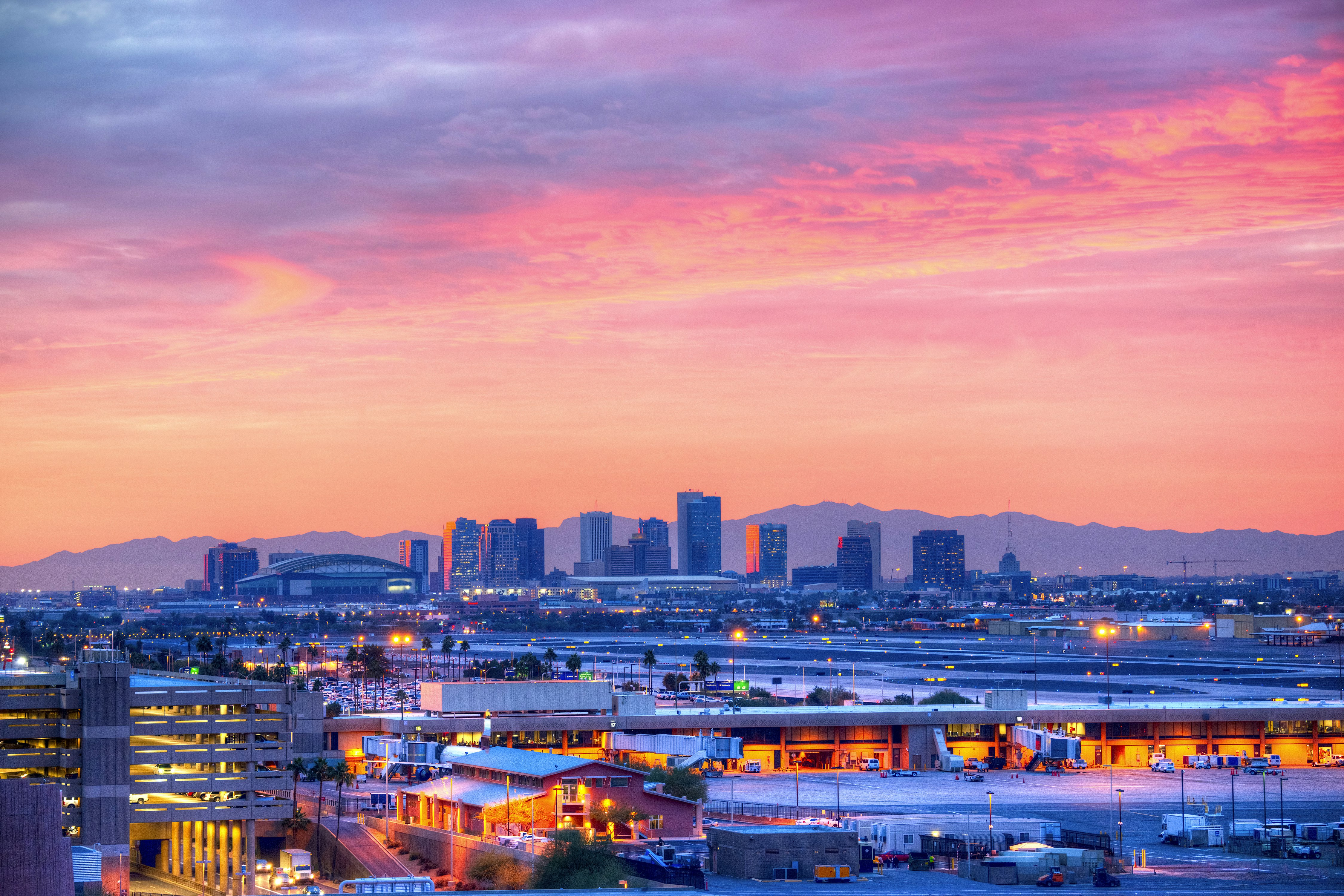 A pink sunrise over the skyline of Phoenix, Arizona