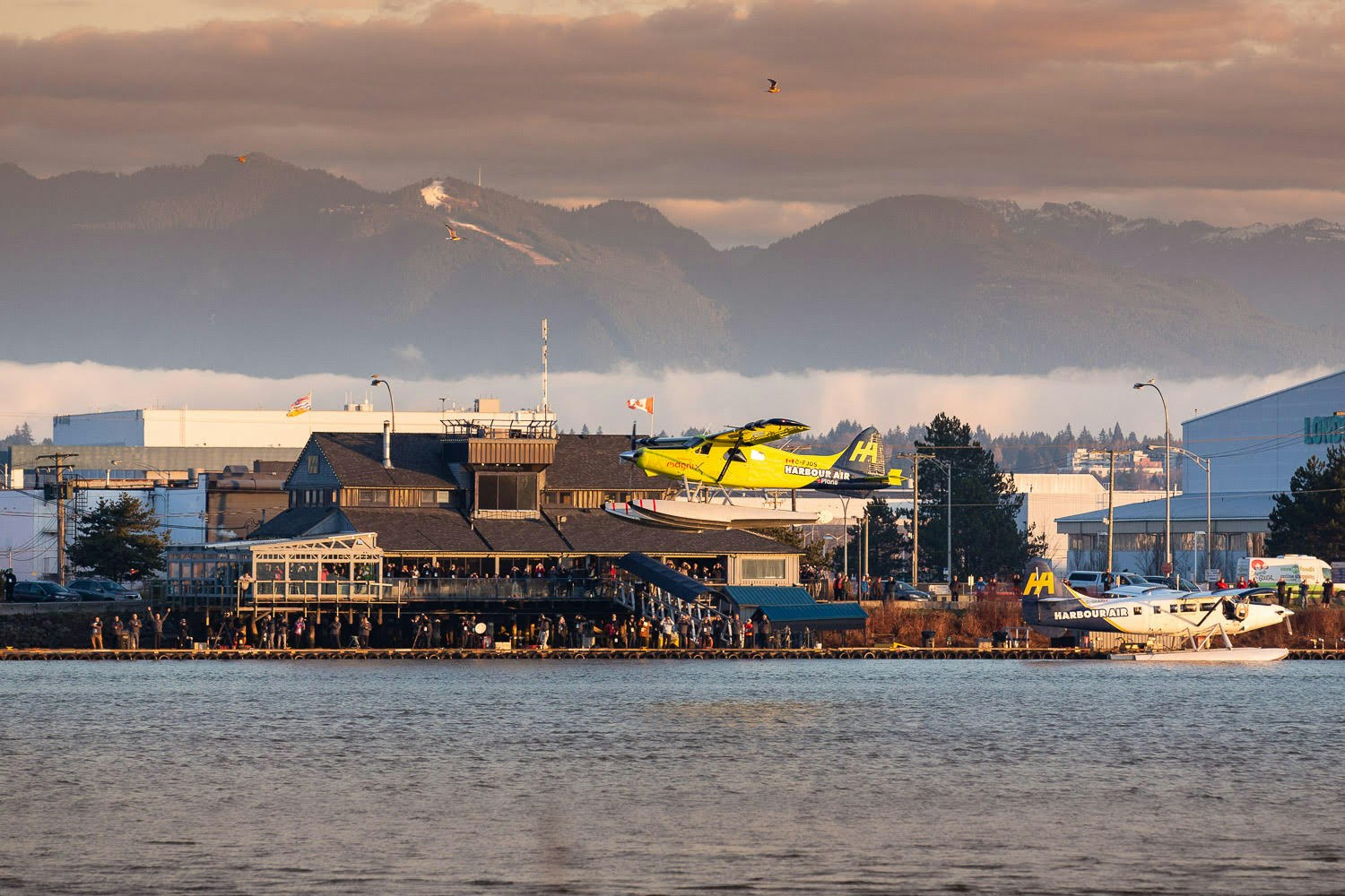 An electric plane taking off over water in Richmond, Canada