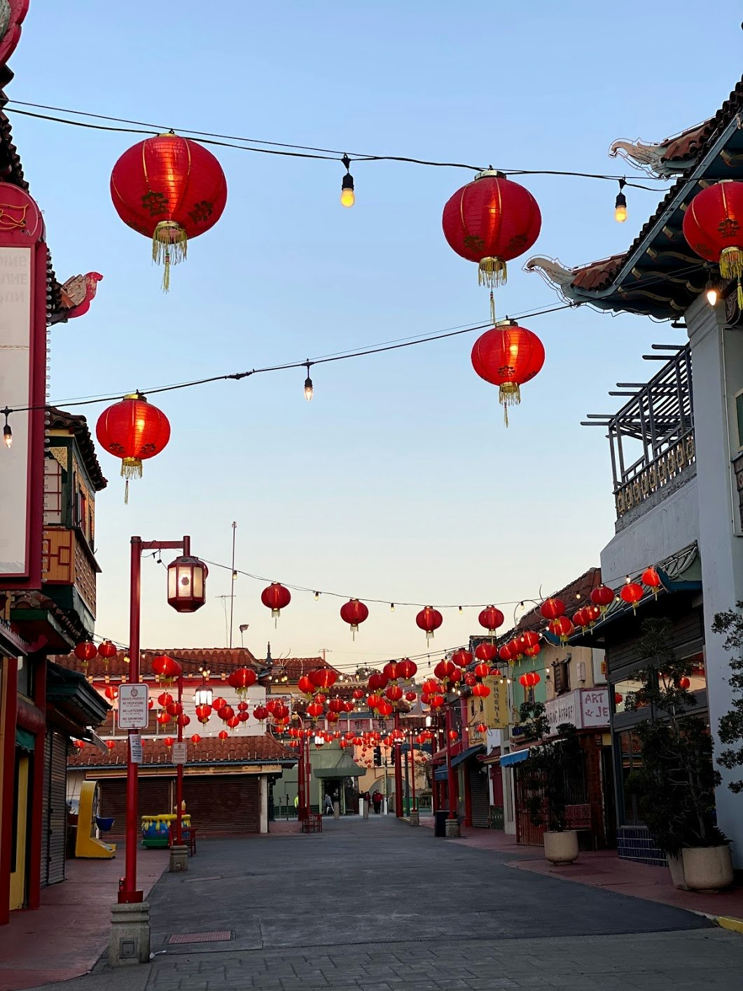 Chinese lanterns hang over an empty street in Los Angeles' Chinatown