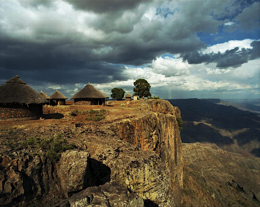 ethiopian-highlands-mequat-mariam.jpg Traditional Ethiopian houses called tukuls sit on a cliff overlooking a deep valley