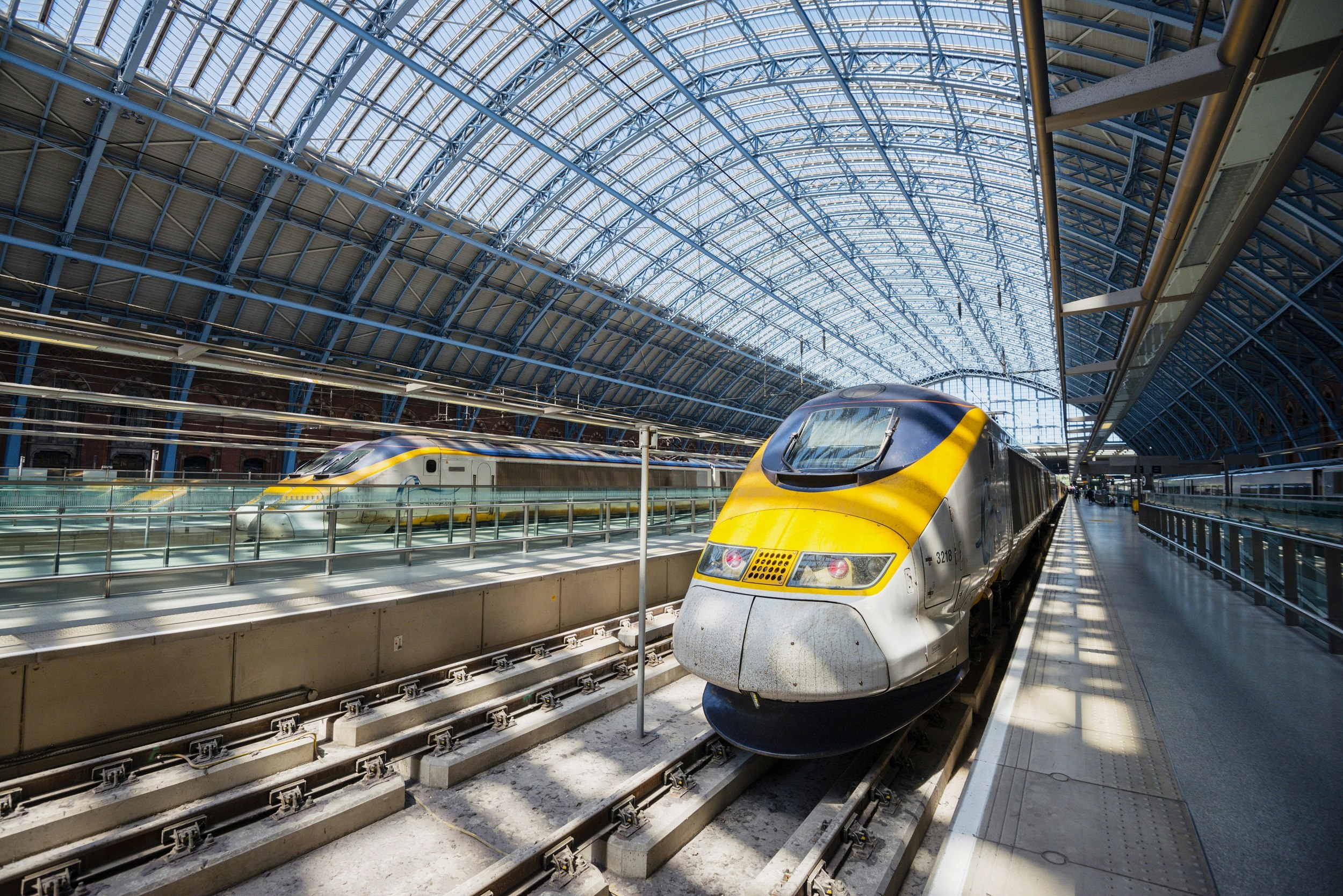 A Eurostar train at St Pancras station in London, with an arched glass and steel roof above