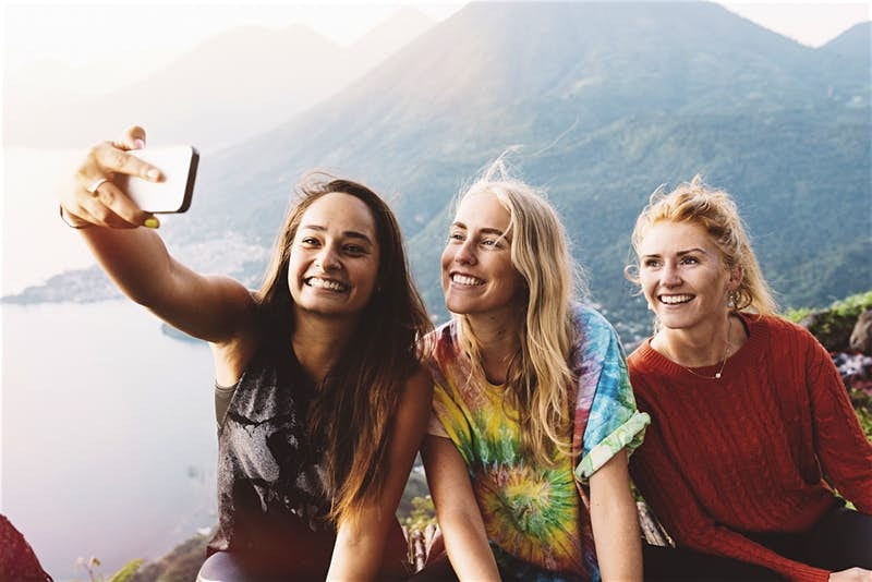 Three female travellers taking a selfie
