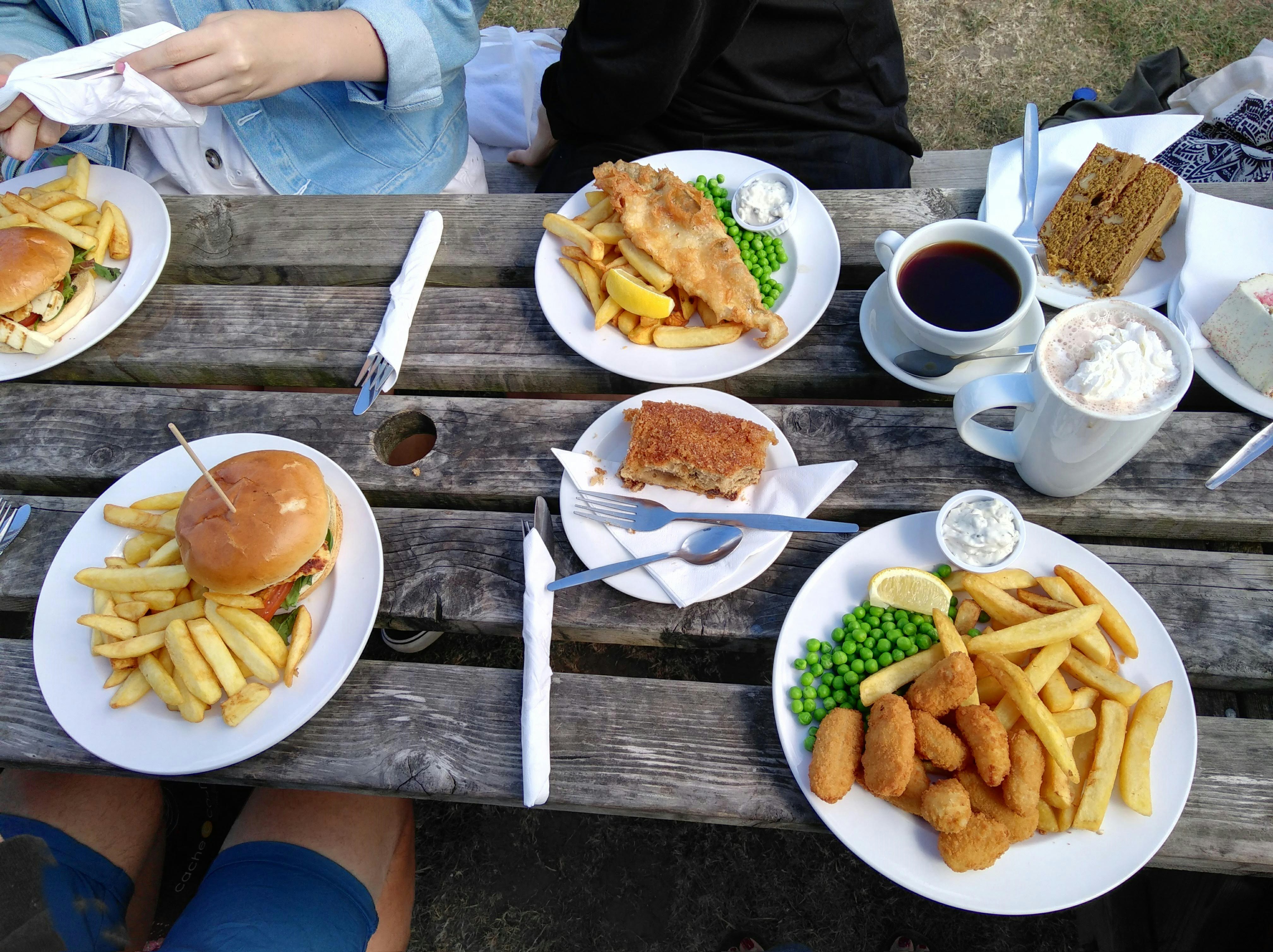 A spread of four main meals, including burgers, fish and chips and two cakes and coffees. New Forest spending diary